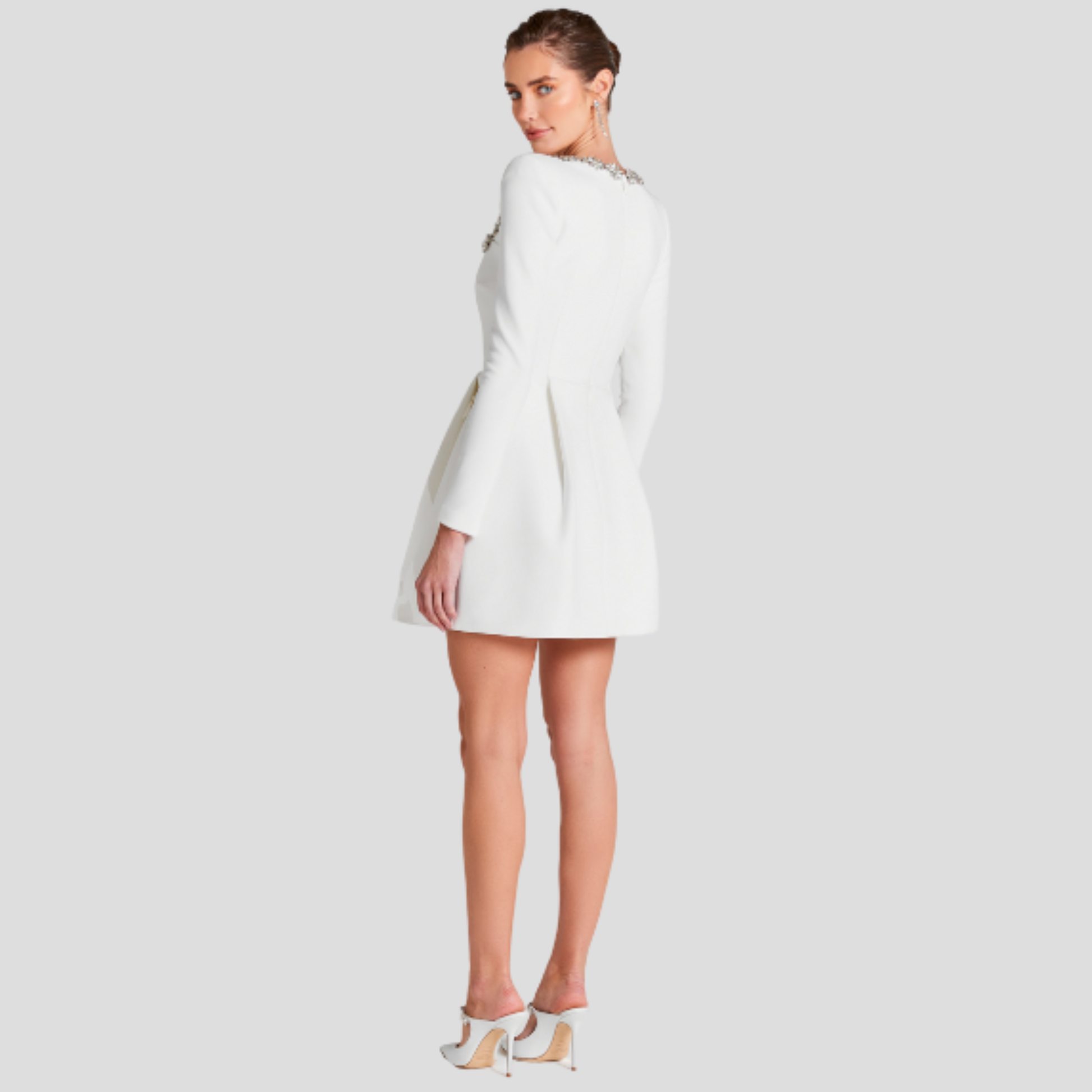 Women's structured cocktail dress with square neckline and embellished detailing in black
