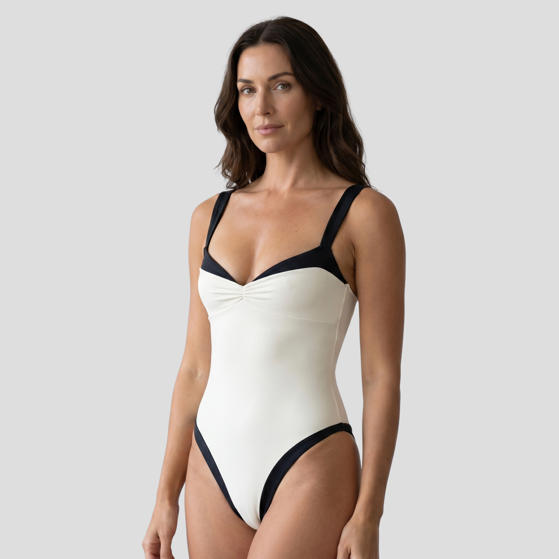 Women's one-piece swimsuit with sweetheart neckline and contrast trim in black and white
