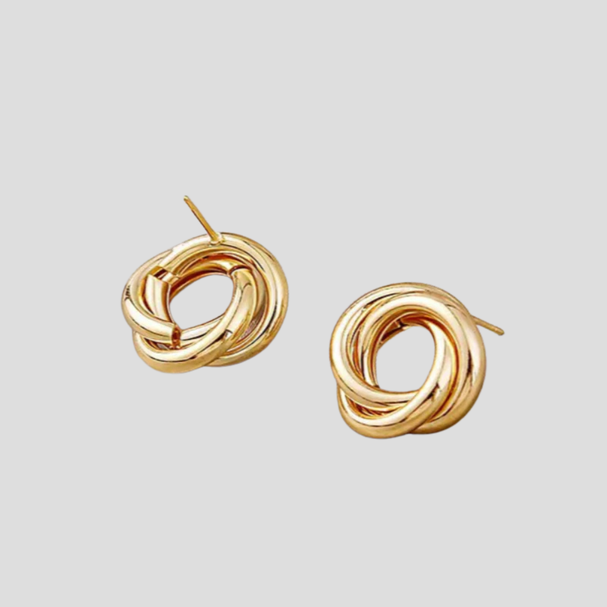 Gold-tone interwoven knot stud earrings with a polished outline for everyday wear