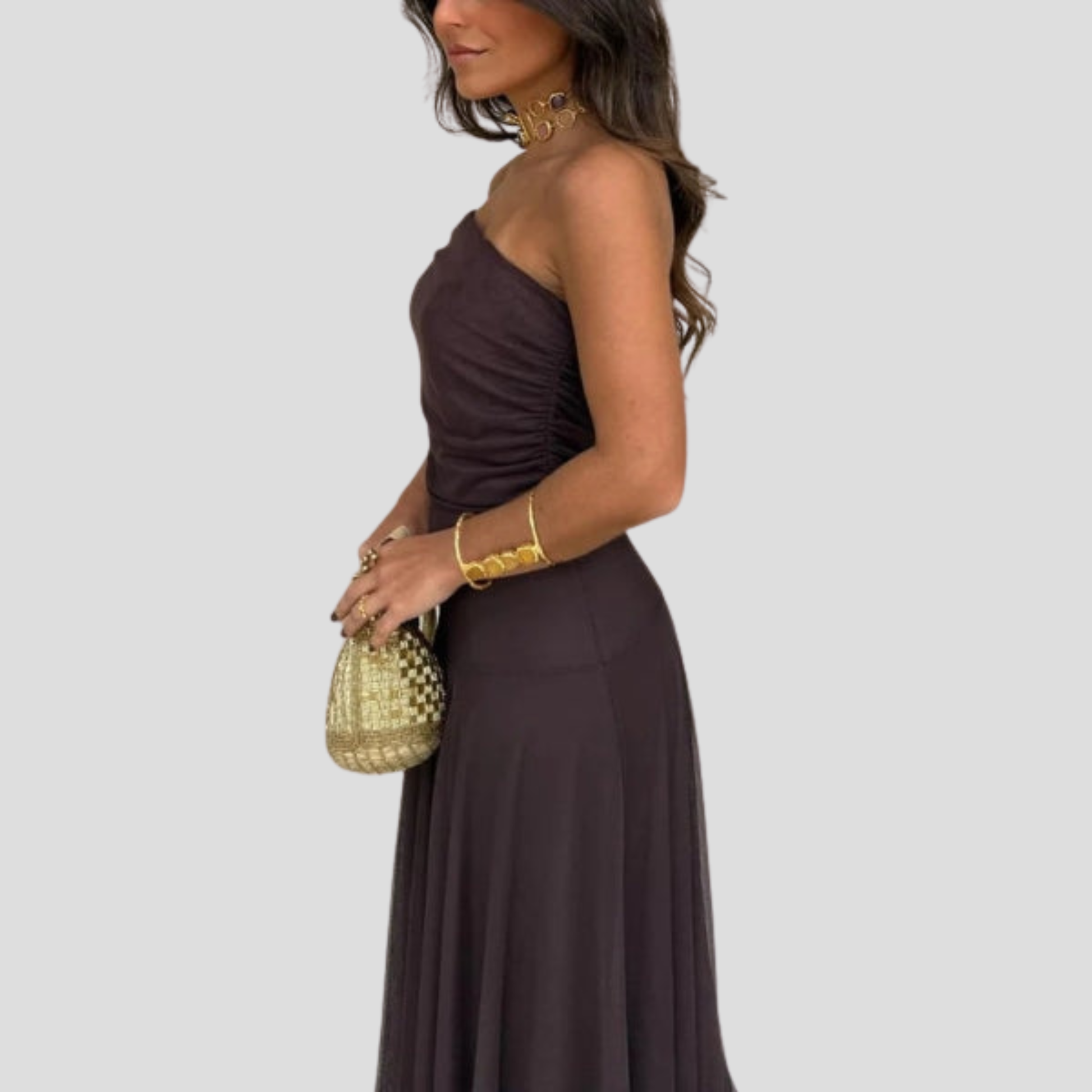Brown off-shoulder maxi dress with sheer overlay and floor-length silhouette for evening wear