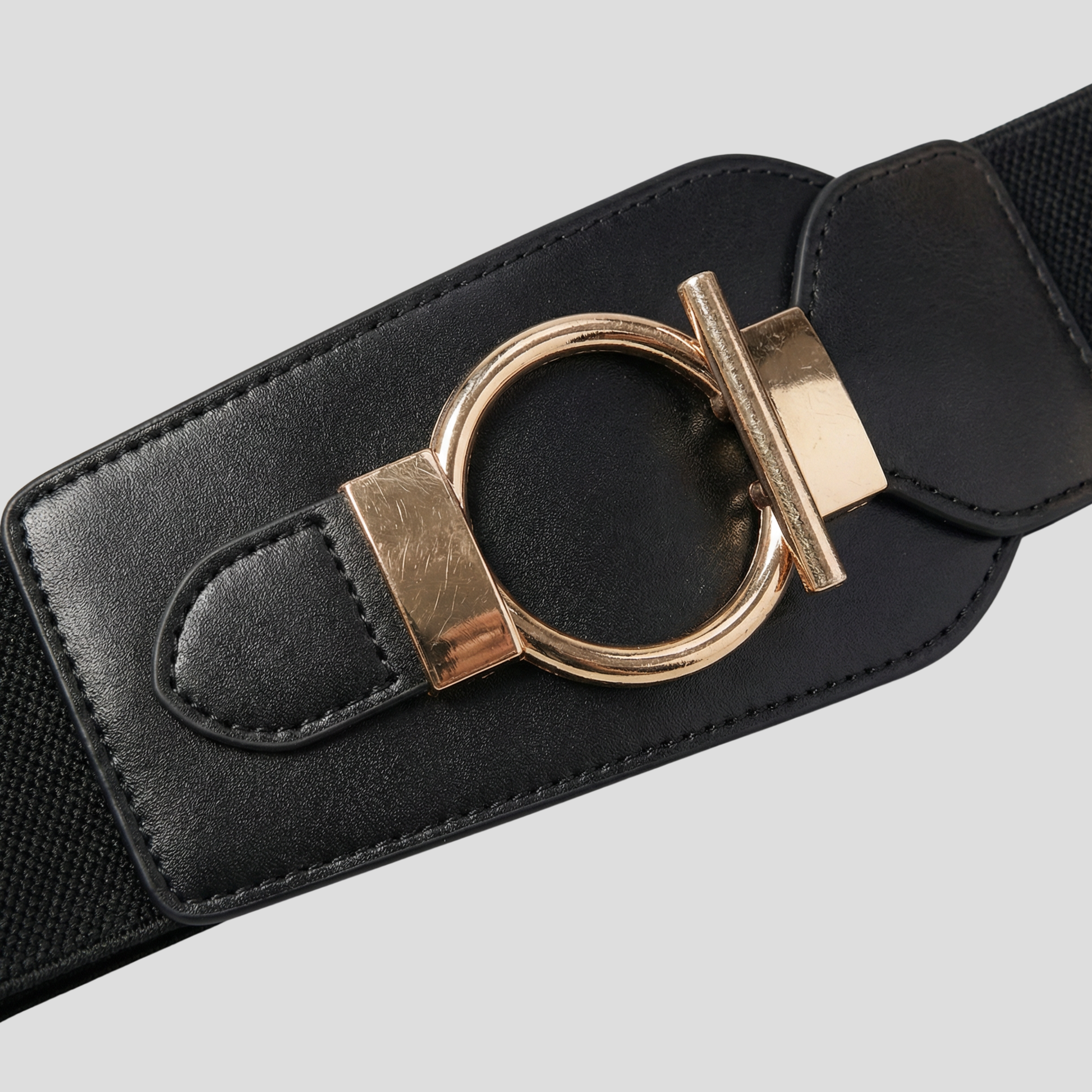 Black women's waist belt with wide front panel and circular buckle