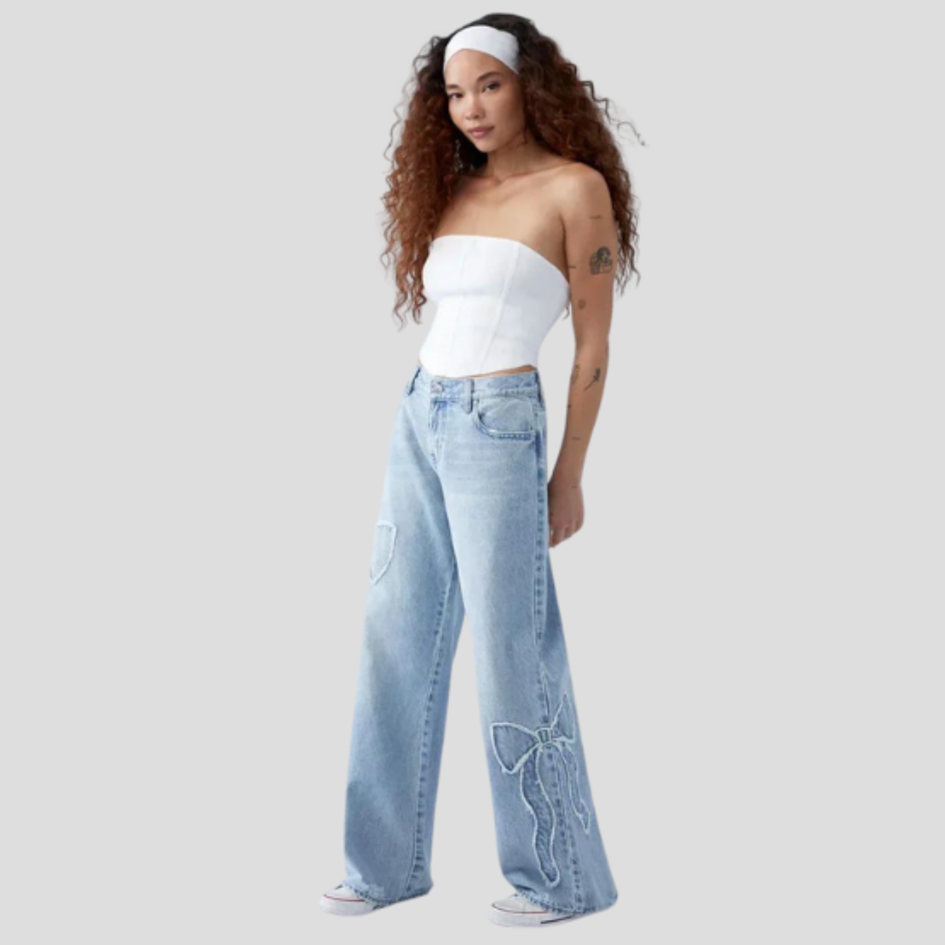 Women's relaxed-fit blue jeans with feminine side bow detail
