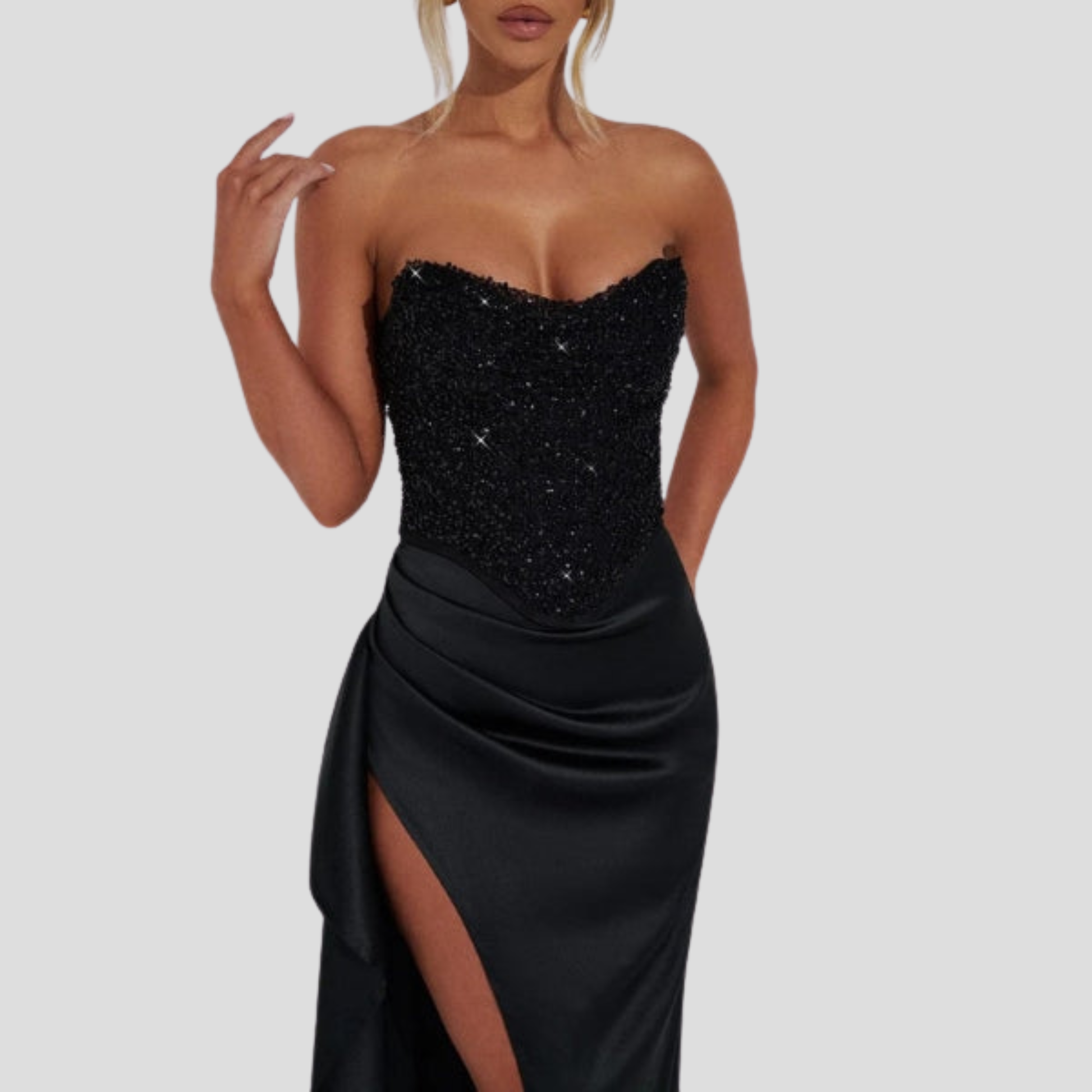 Strapless maxi evening gown with beaded bodice and high-slit skirt in black and white