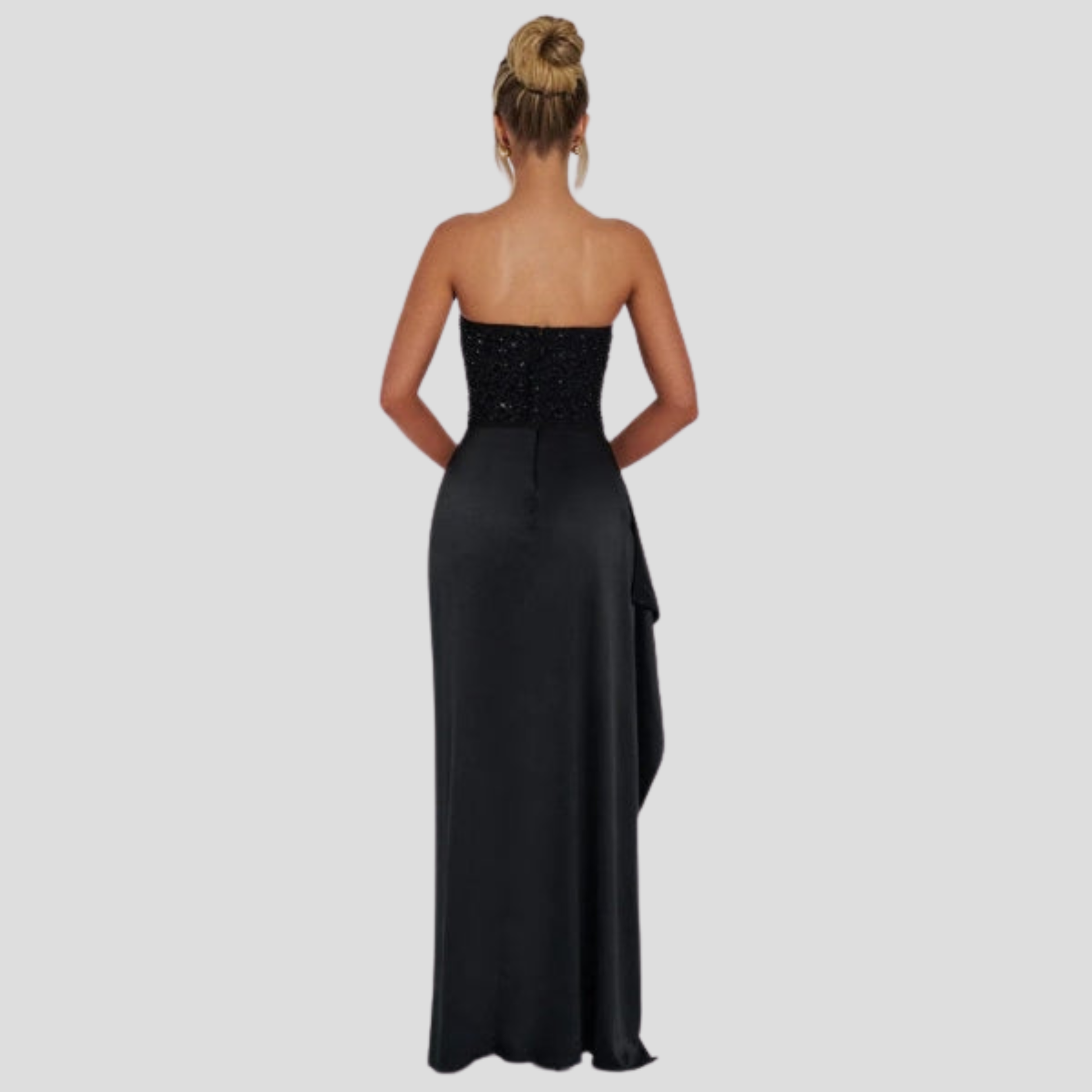 Strapless maxi evening gown with beaded bodice and high-slit skirt in black and white