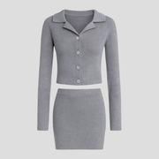 Women's grey two-piece knit set with cardigan top and coordinated skirt