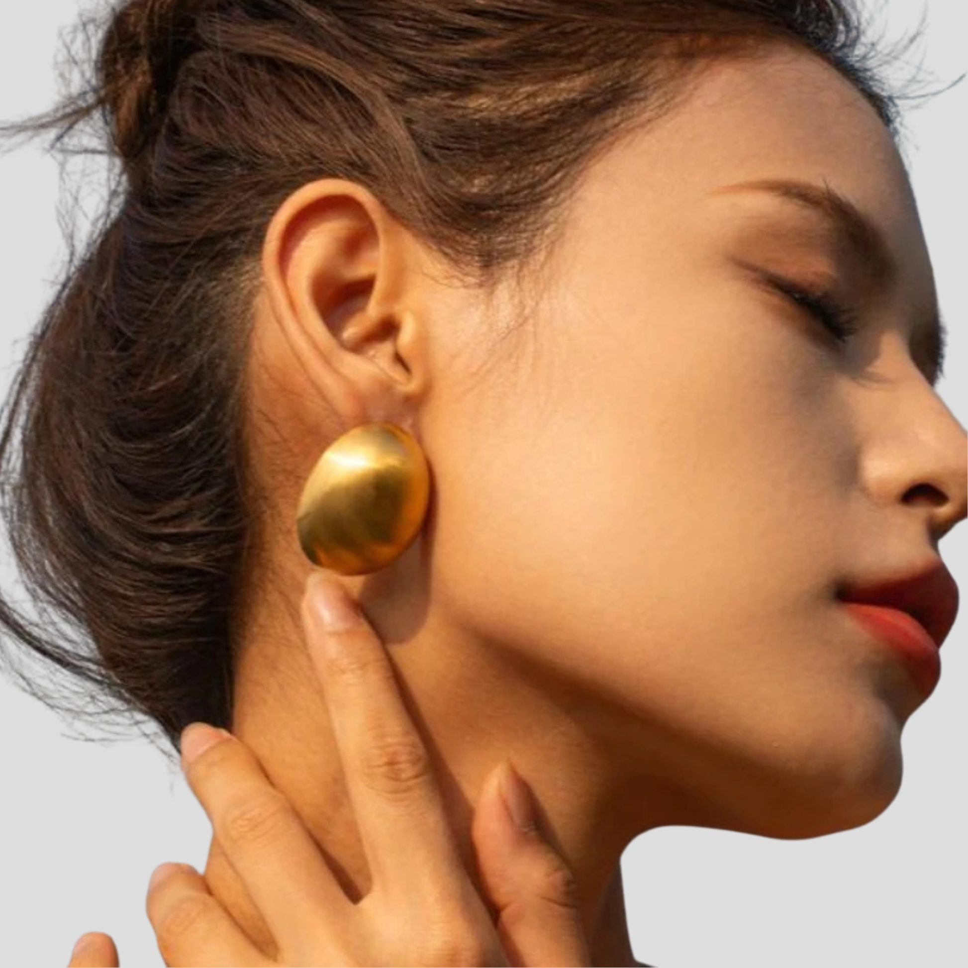 Dome silhouette stud earrings with a matte gold finish for everyday wear