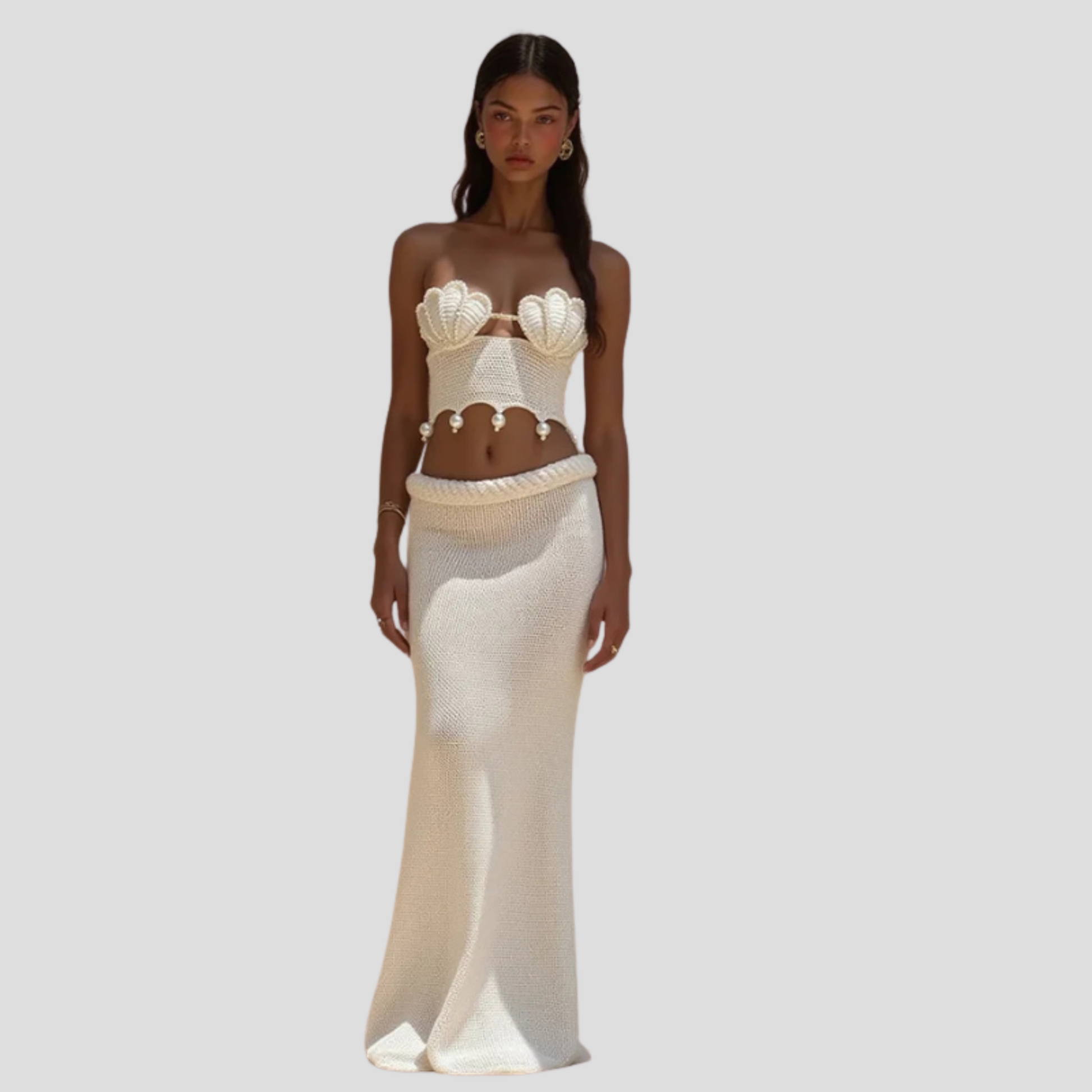 Women's white two-piece set with shell-inspired bodice and full-length skirt for occasions