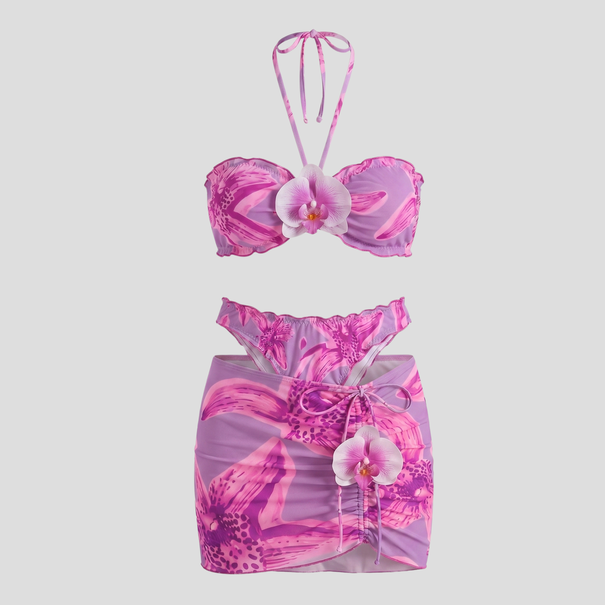 Women's three-piece floral resort set with halter top and wrap-style mini skirt