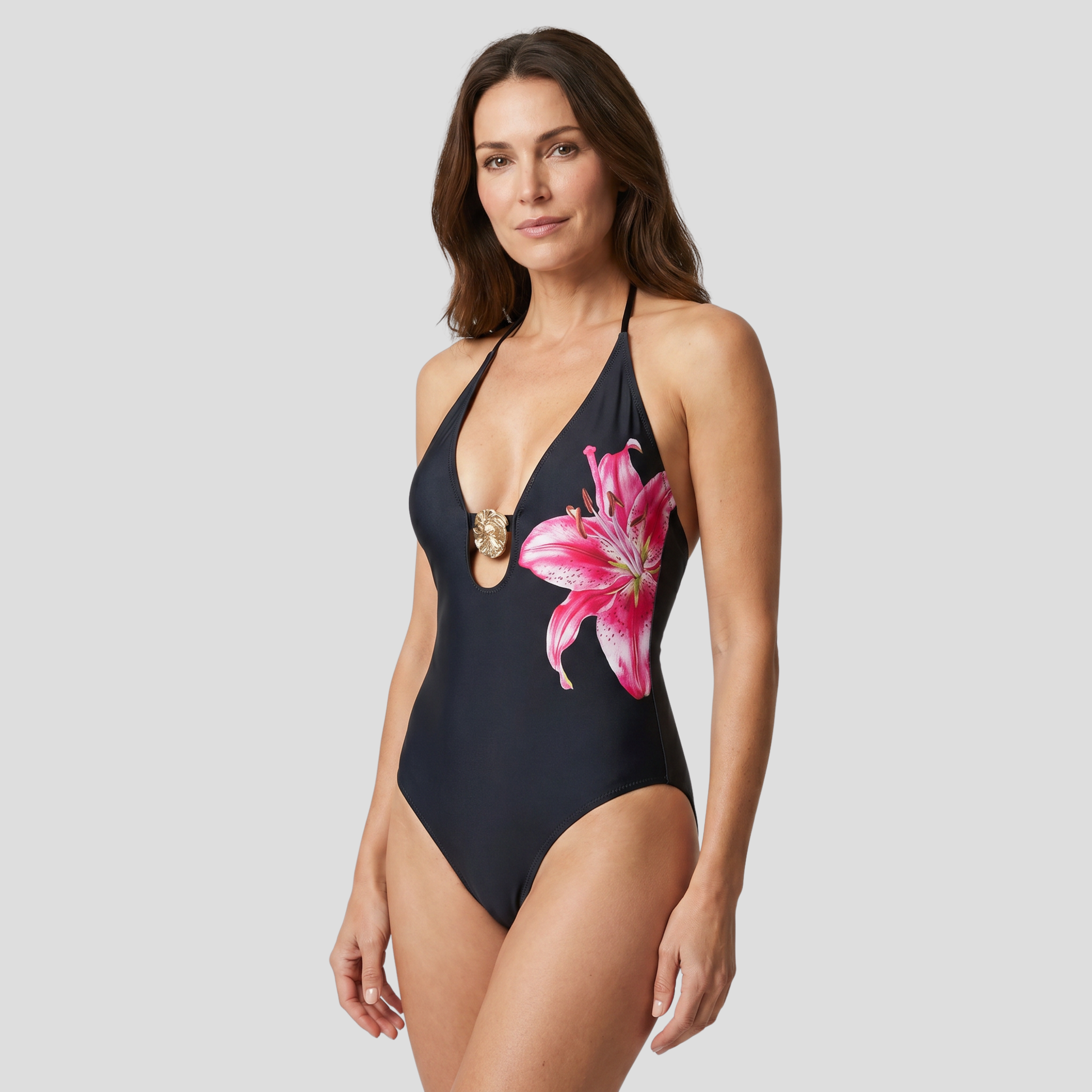 Black deep-V one-piece swimsuit with floral pattern, halter ties and gold-tone accent