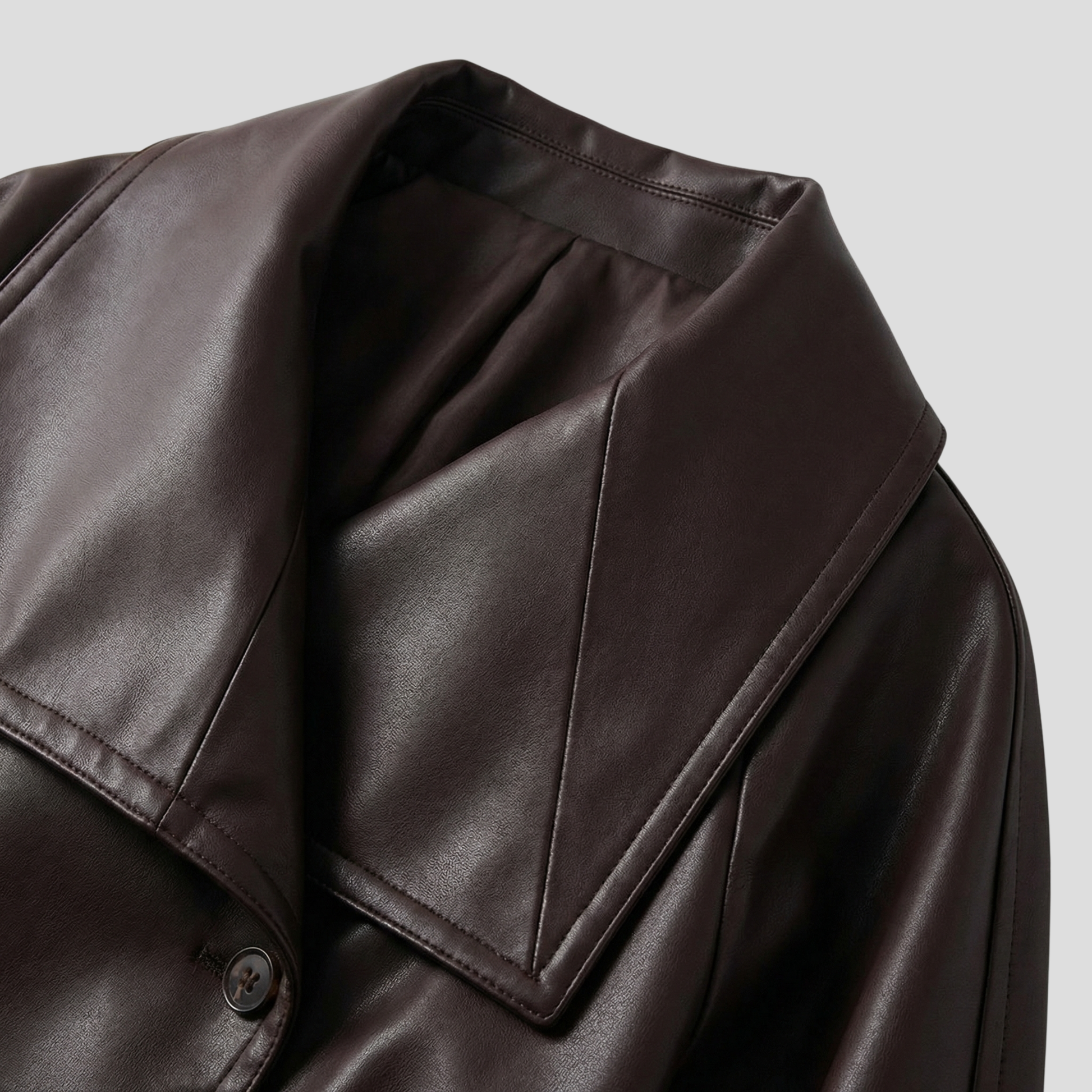 Brown cropped double-breasted women's jacket with defined collar and clean lines