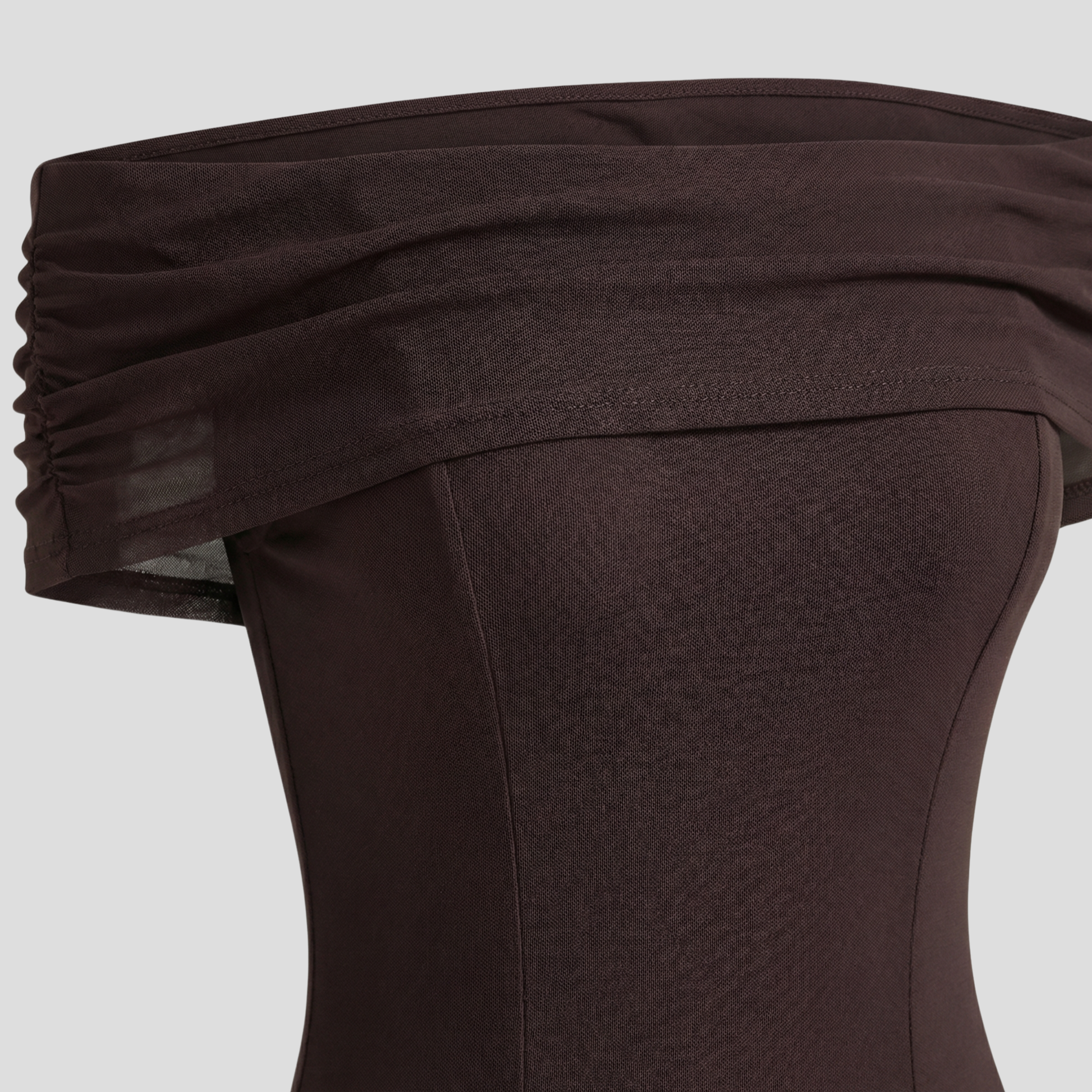 Brown off-shoulder maxi dress with sheer overlay and floor-length silhouette for evening wear