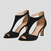 Women's sculpted cutout high-heel sandals with streamlined ankle strap in black and pink