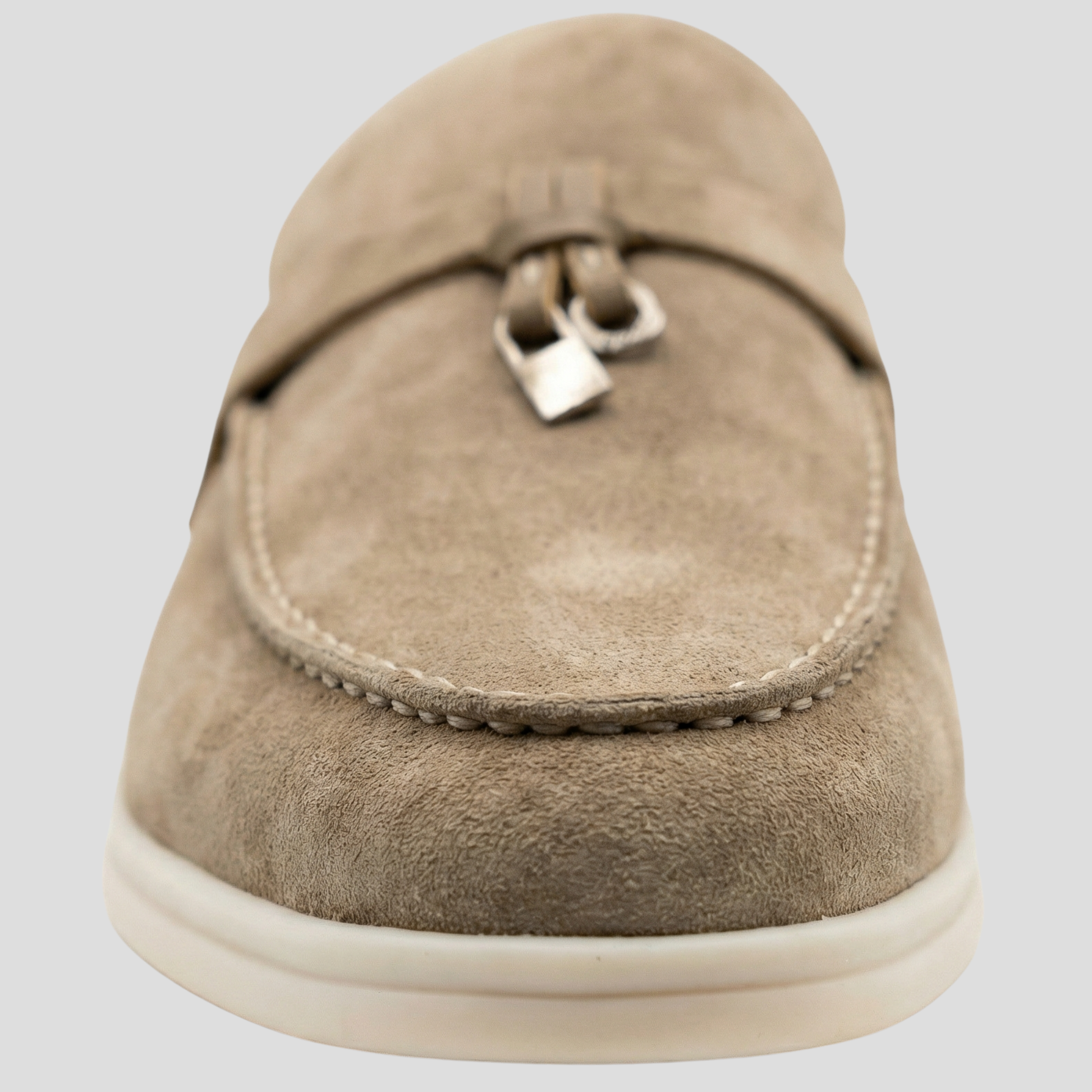 Women's backless loafer mules with tassel detail shown in multiple colors