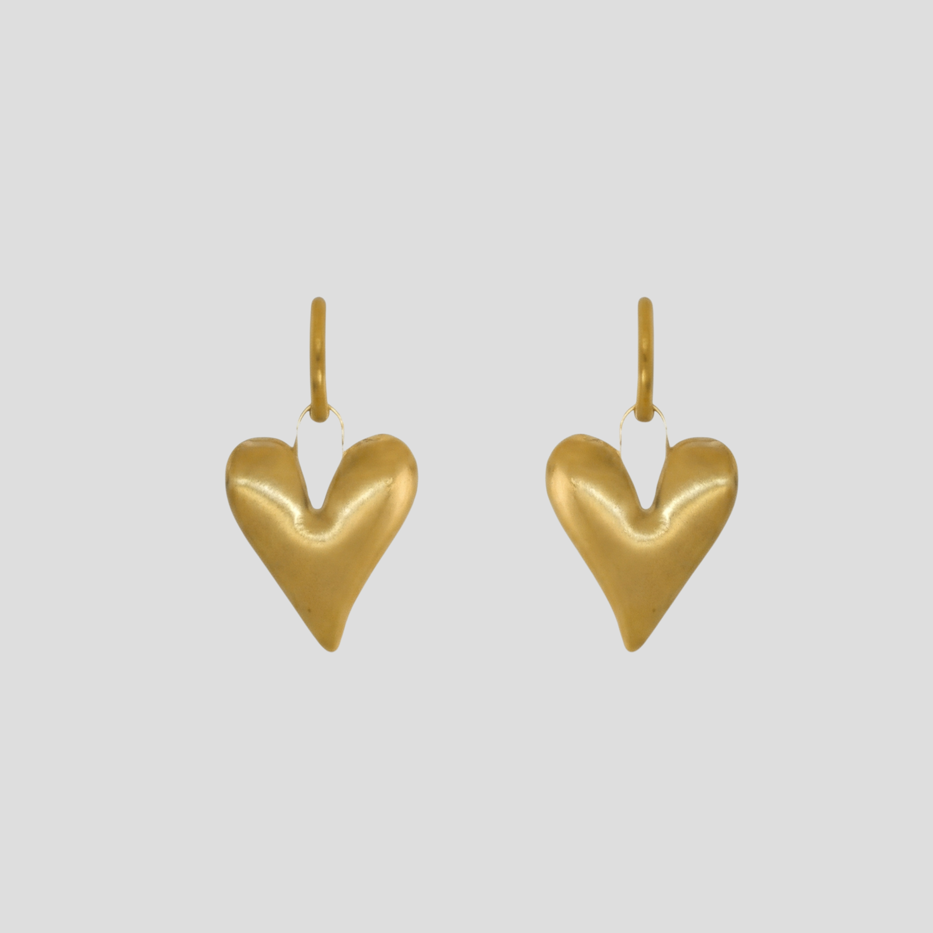 Gold-tone sculpted heart outline earrings for everyday wear