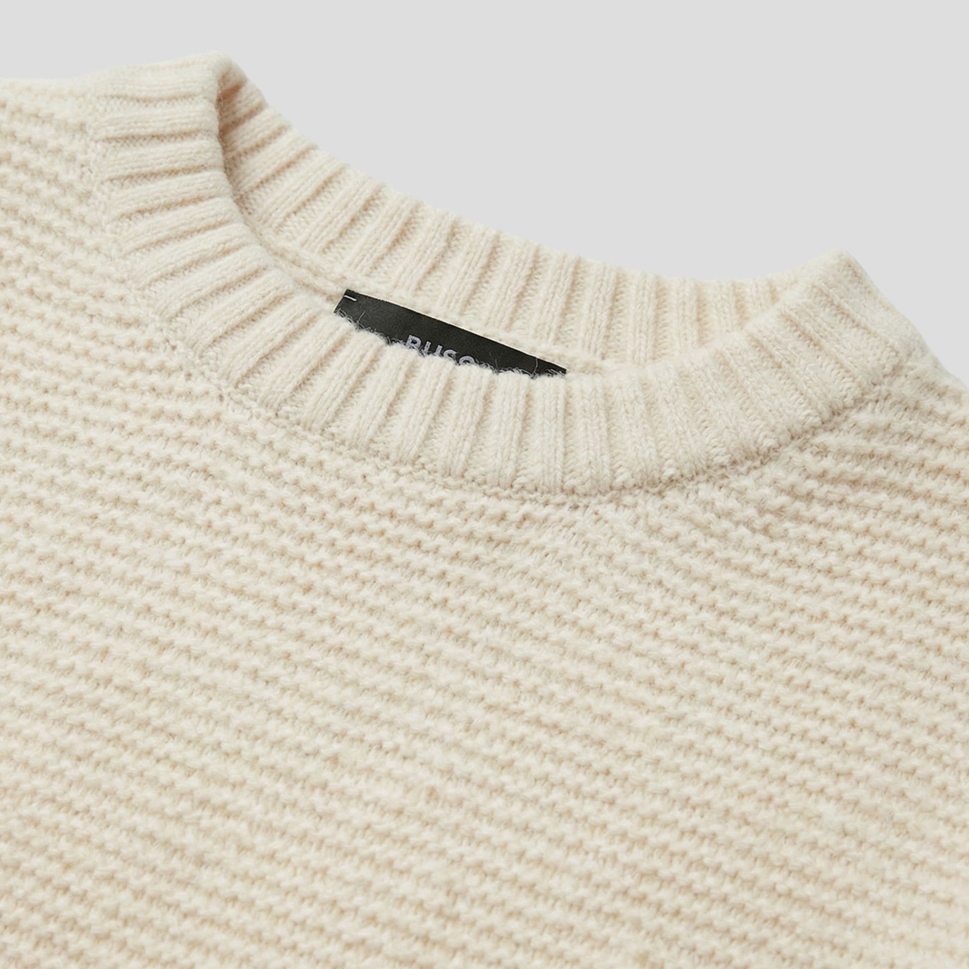 Women's white textured crew neck sweater with a relaxed everyday silhouette