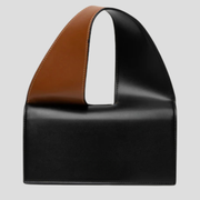Black structured women's handbag with two-tone handle detail for daily wear