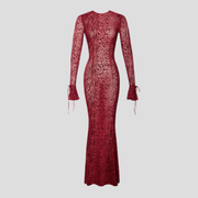 Red long sleeve maxi dress with flared cuff detail and flowing silhouette