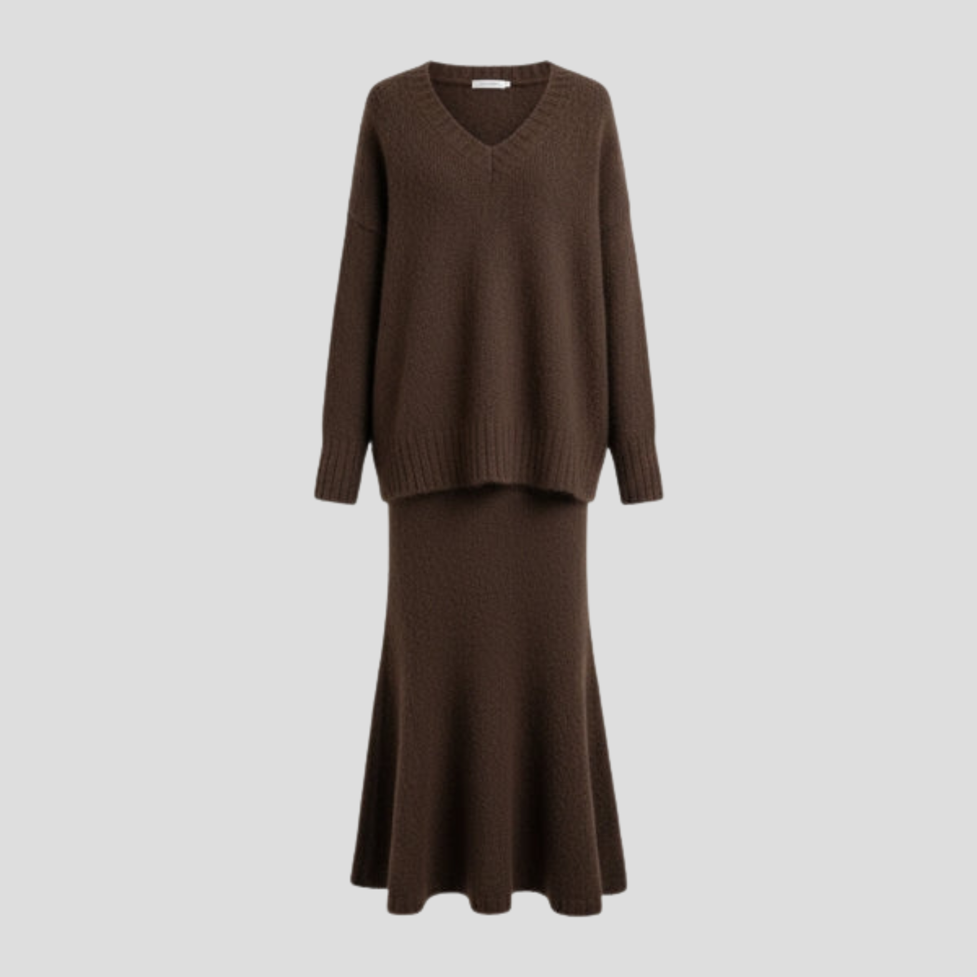 Women's two-piece skirt set with V-neck top and flowing midi skirt