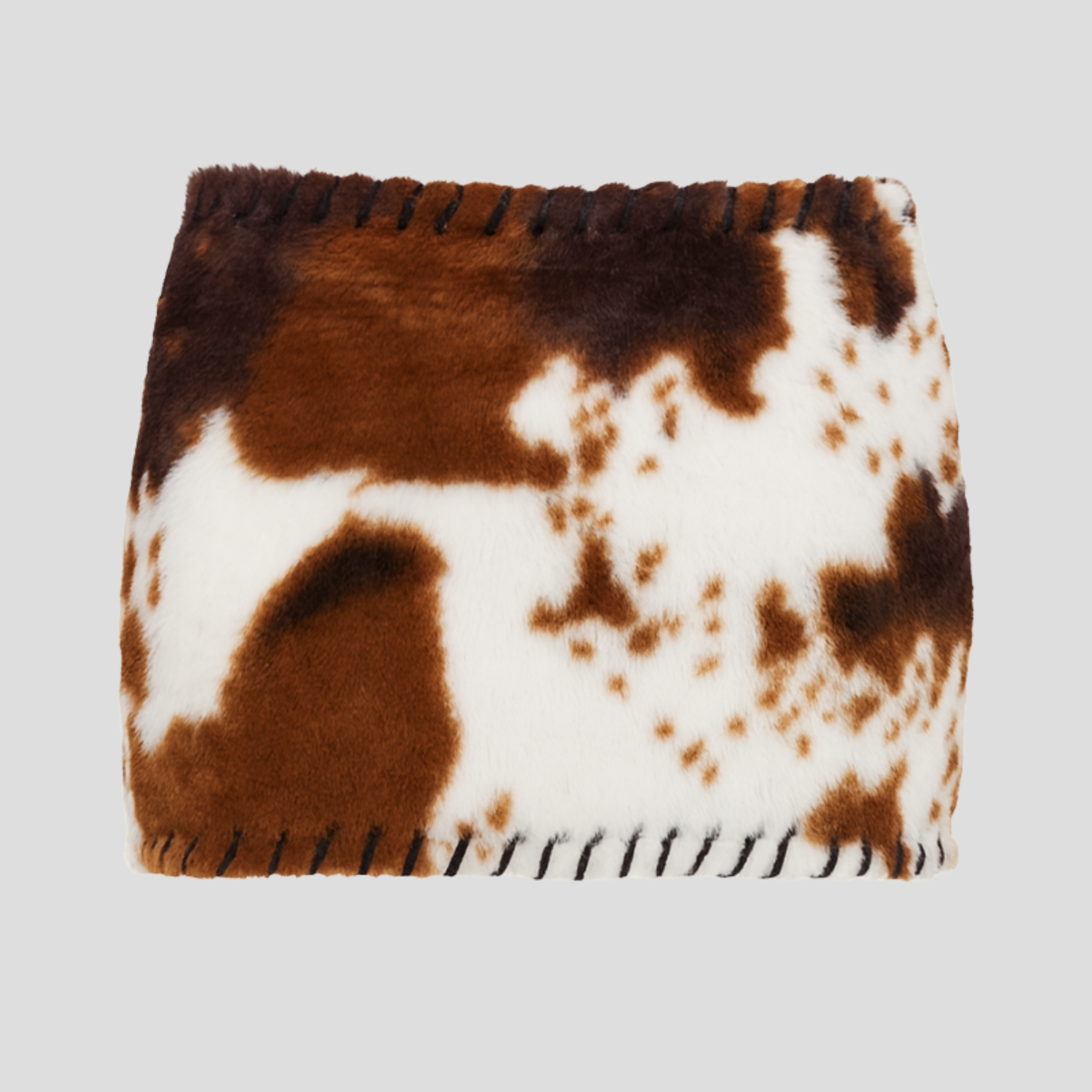 Brown cow print micro mini skirt with whipstitch edge detail