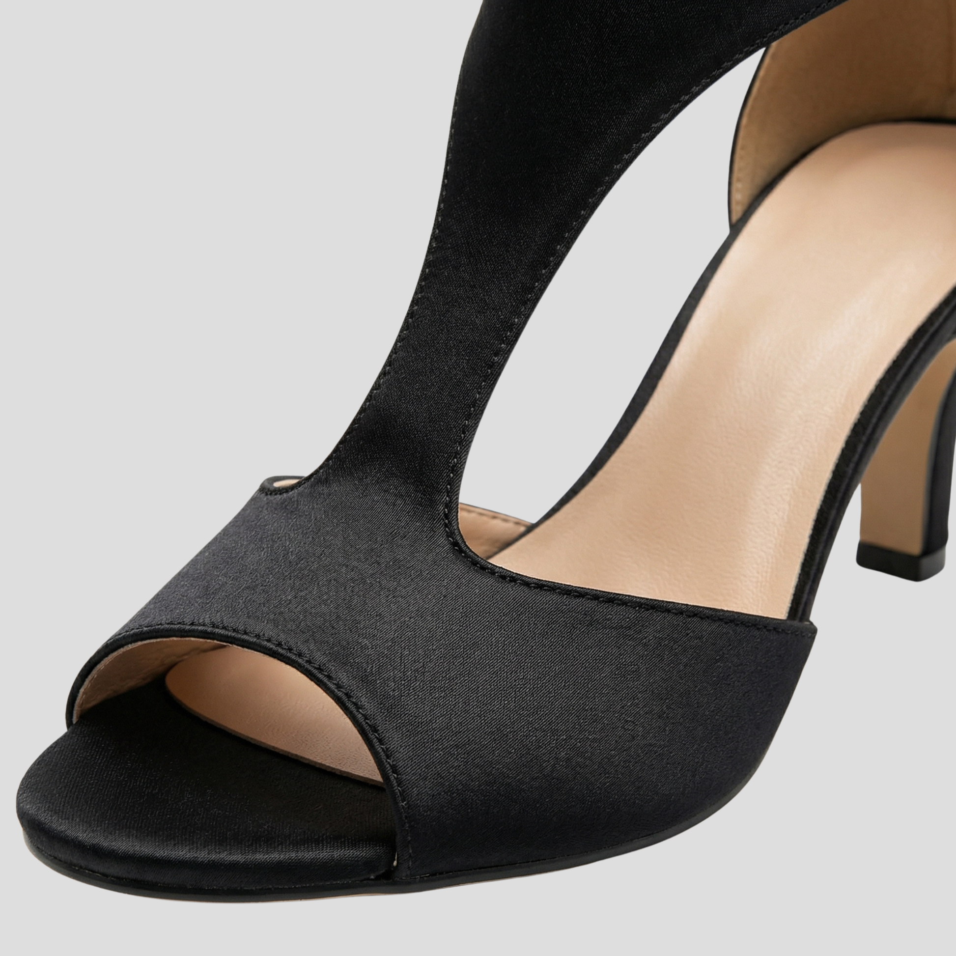 Women's sculpted cutout high-heel sandals with streamlined ankle strap in black and pink