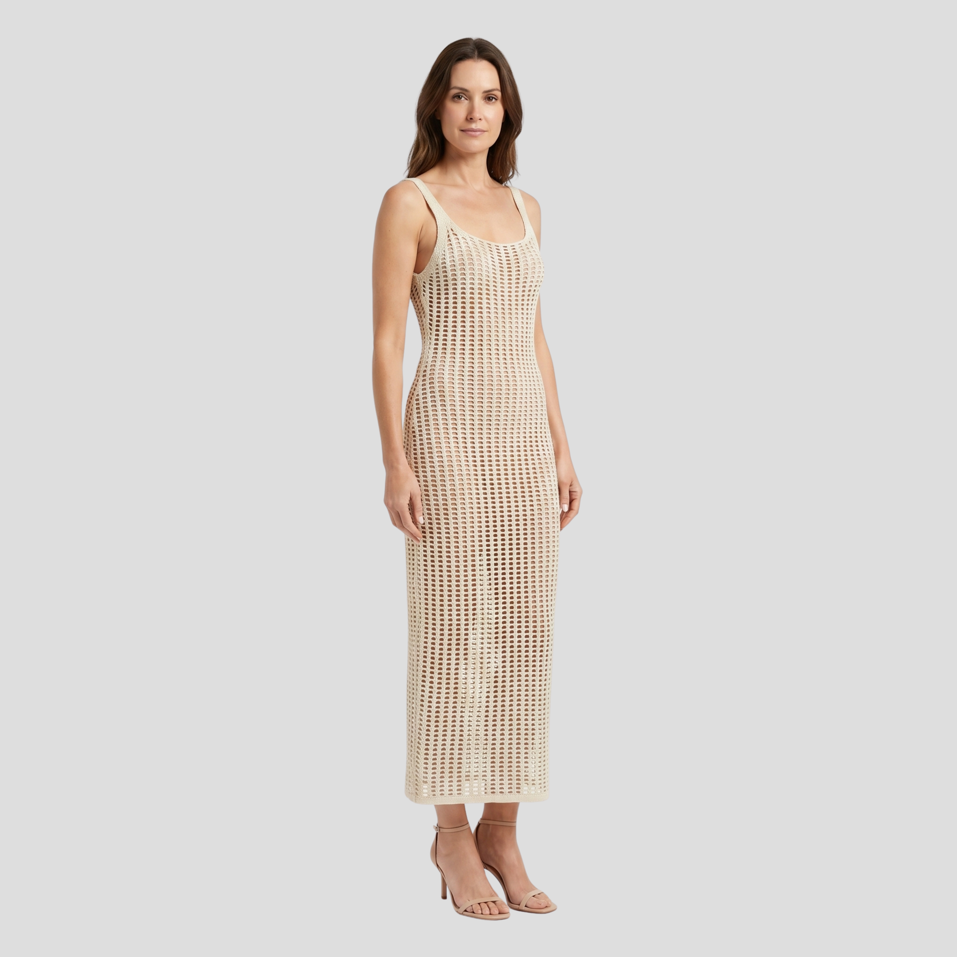 White backless maxi dress with open pattern and elongated floor-length silhouette