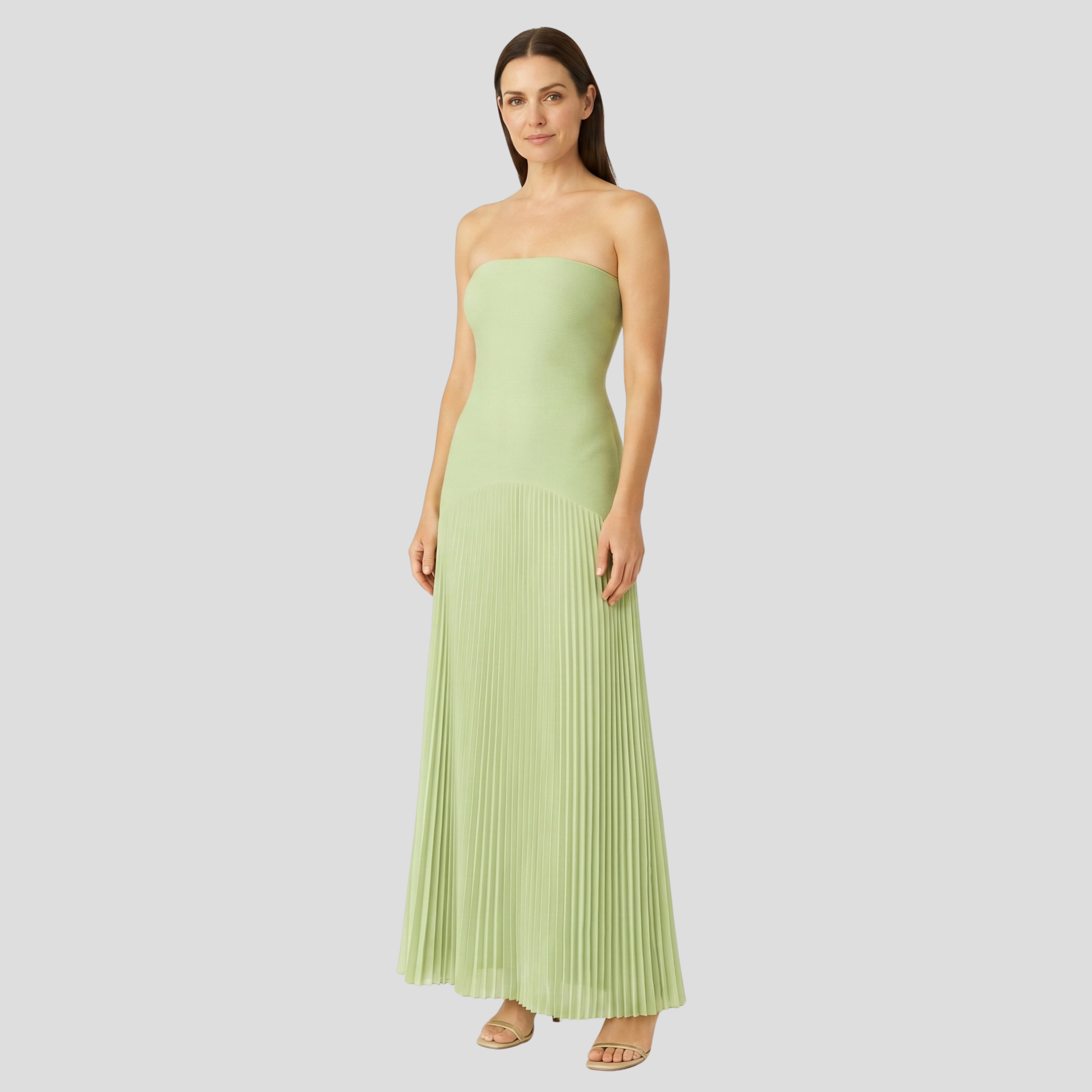 Green sleeveless drop-waist maxi dress with an elongated silhouette
