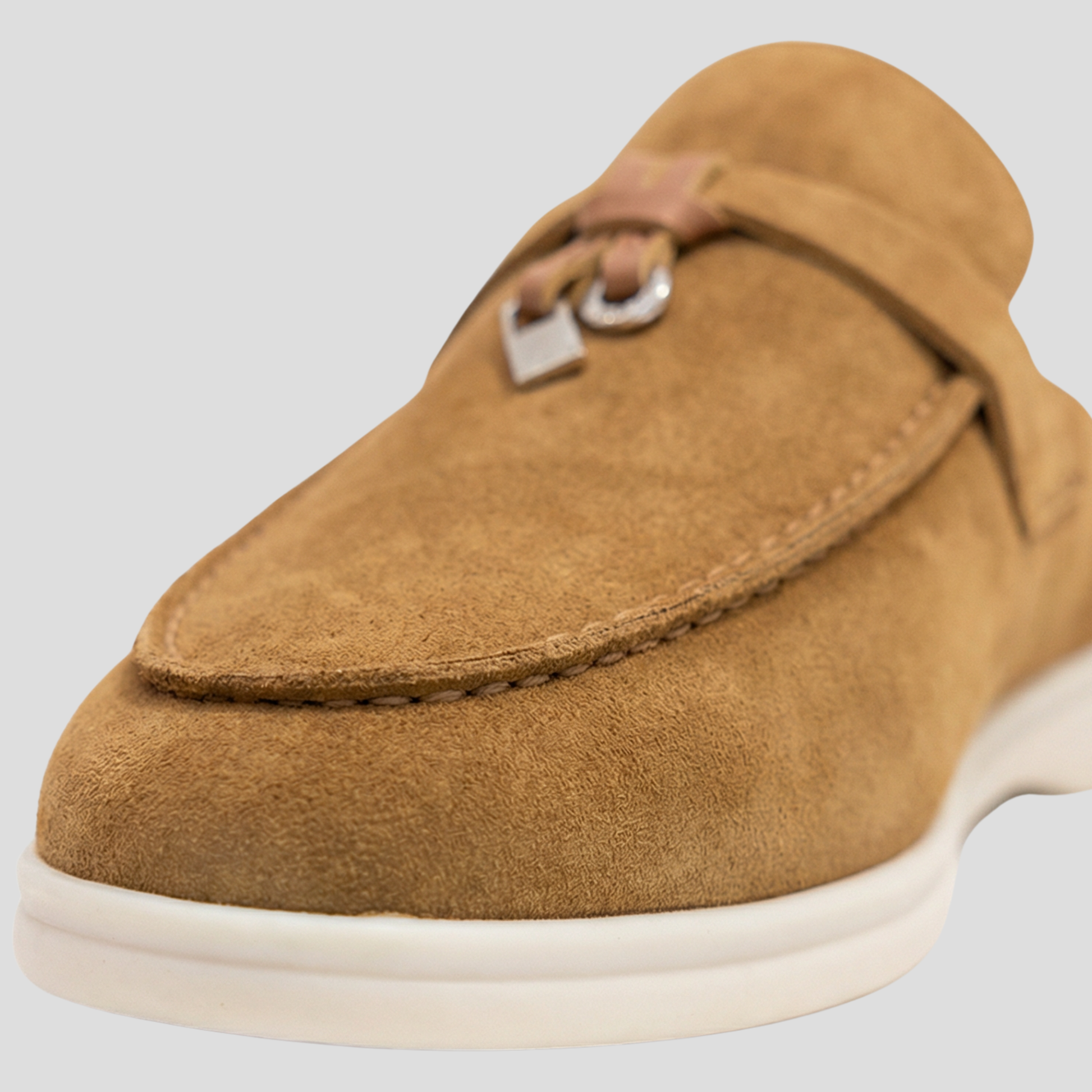 Women's backless loafer mules with tassel detail shown in multiple colors