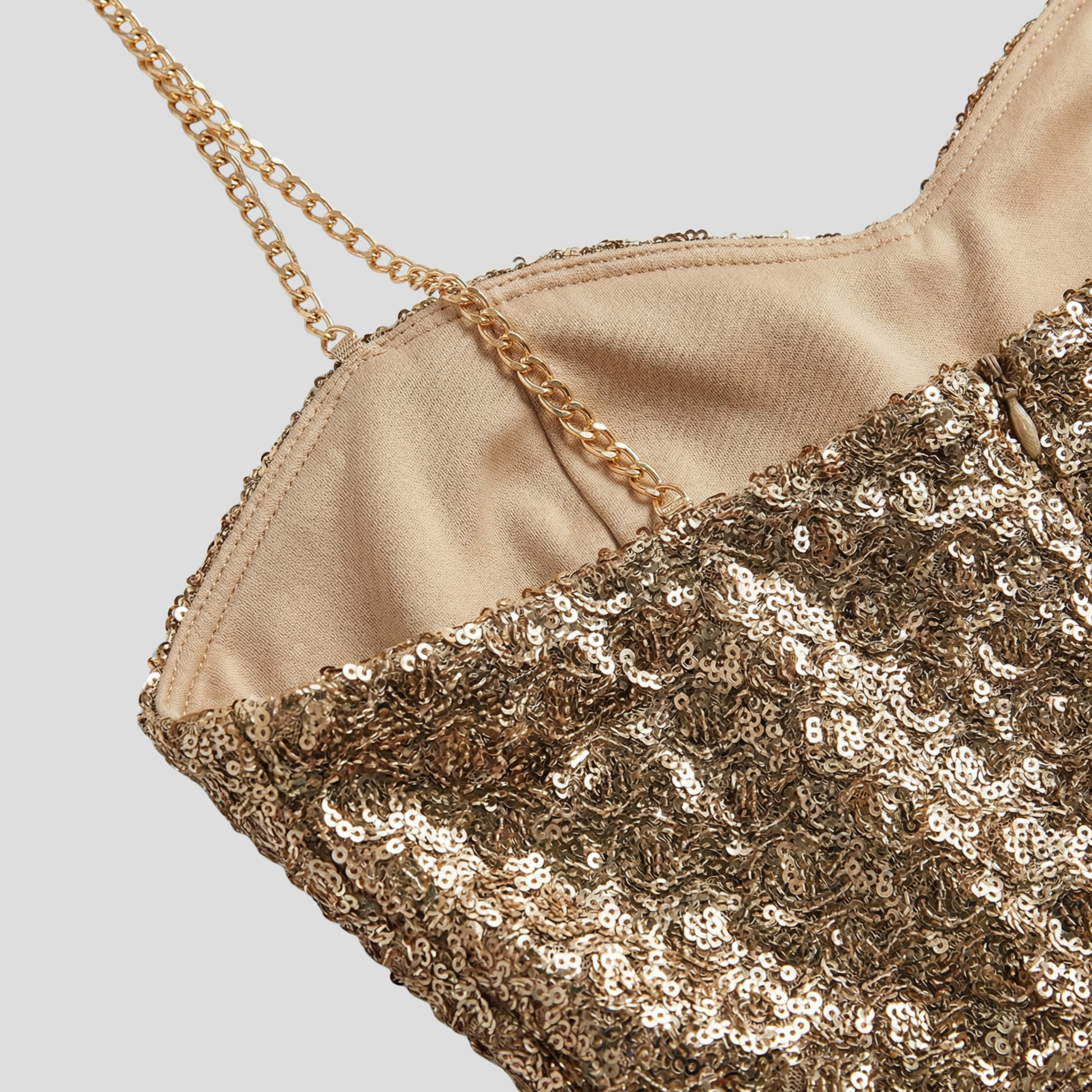 Women's strapless gold jumpsuit with a belted waist