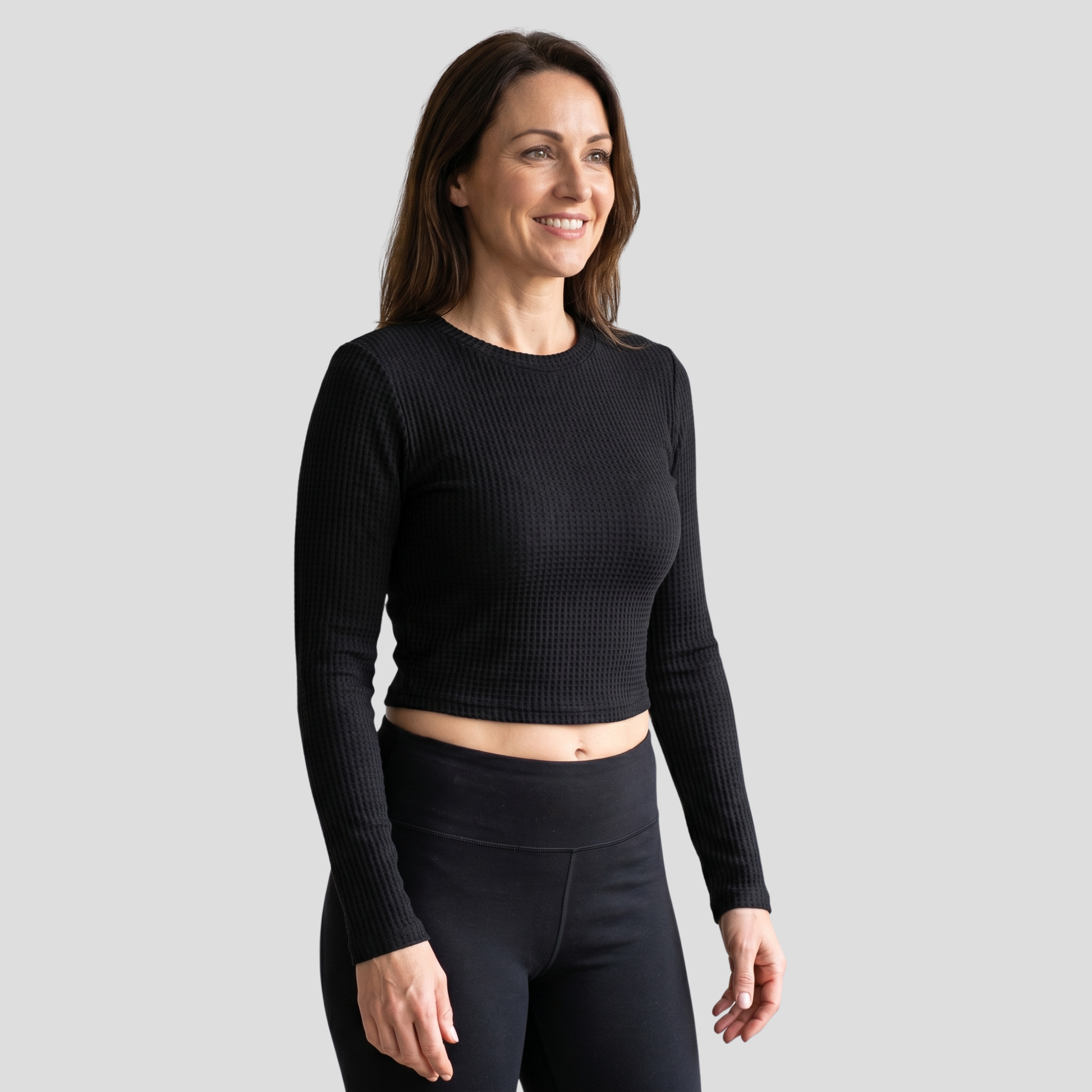 Women's textured long-sleeve top with contoured lines, shown in neutral tones