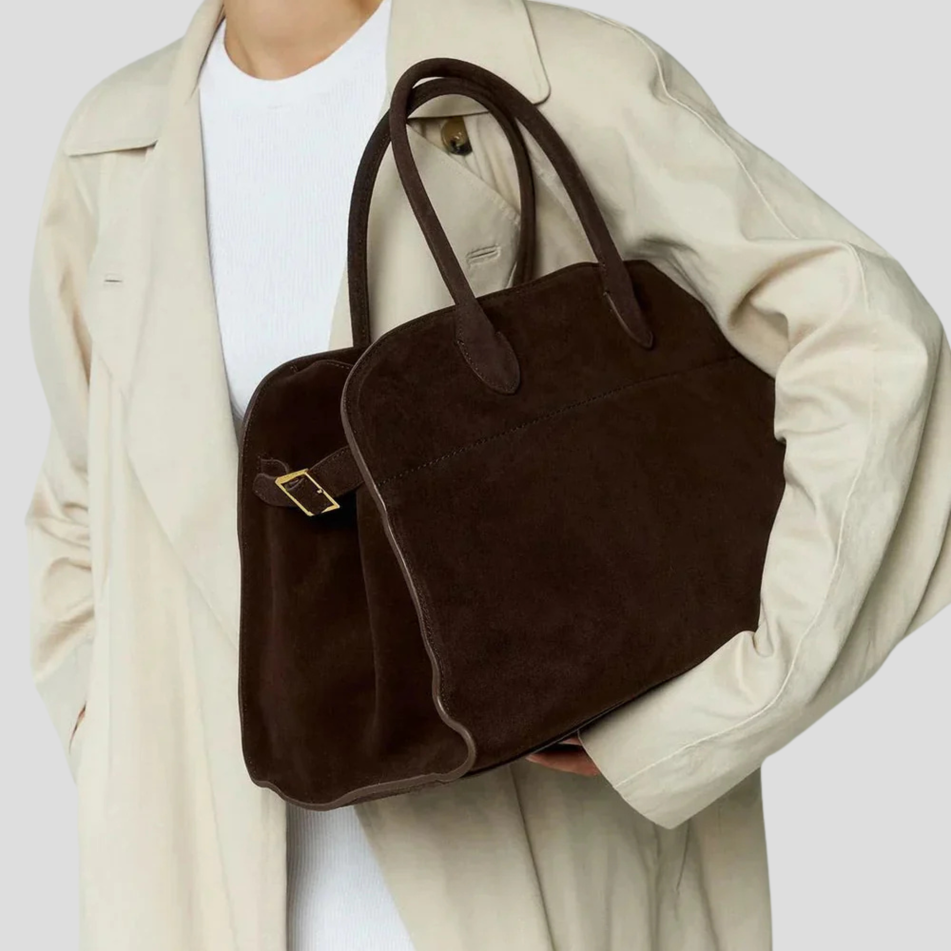 Brown women's bag with softly shaped silhouette and buckle detail for daily carry