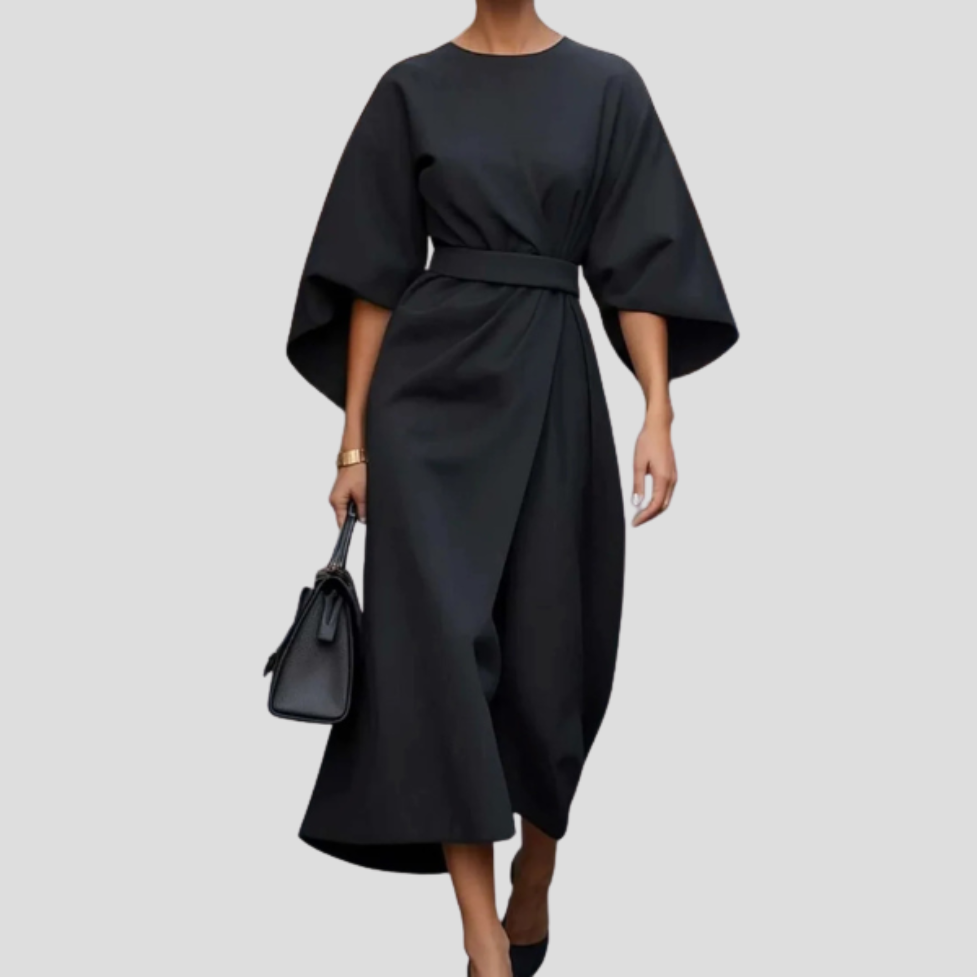 Women's belted floor-length maxi dress with a flowing skirt and defined waist