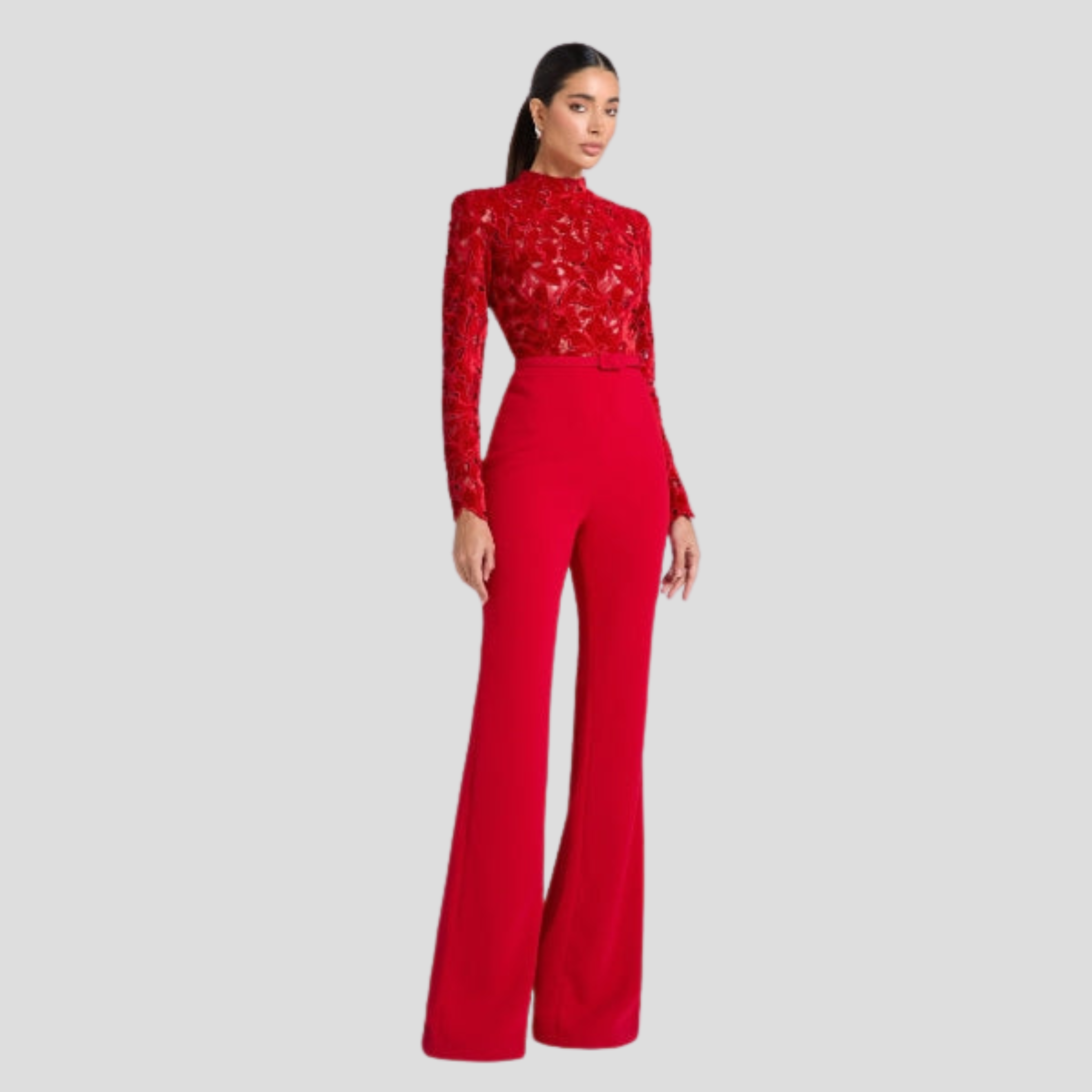 Red women's high-neck jumpsuit with belted waist and flared silhouette