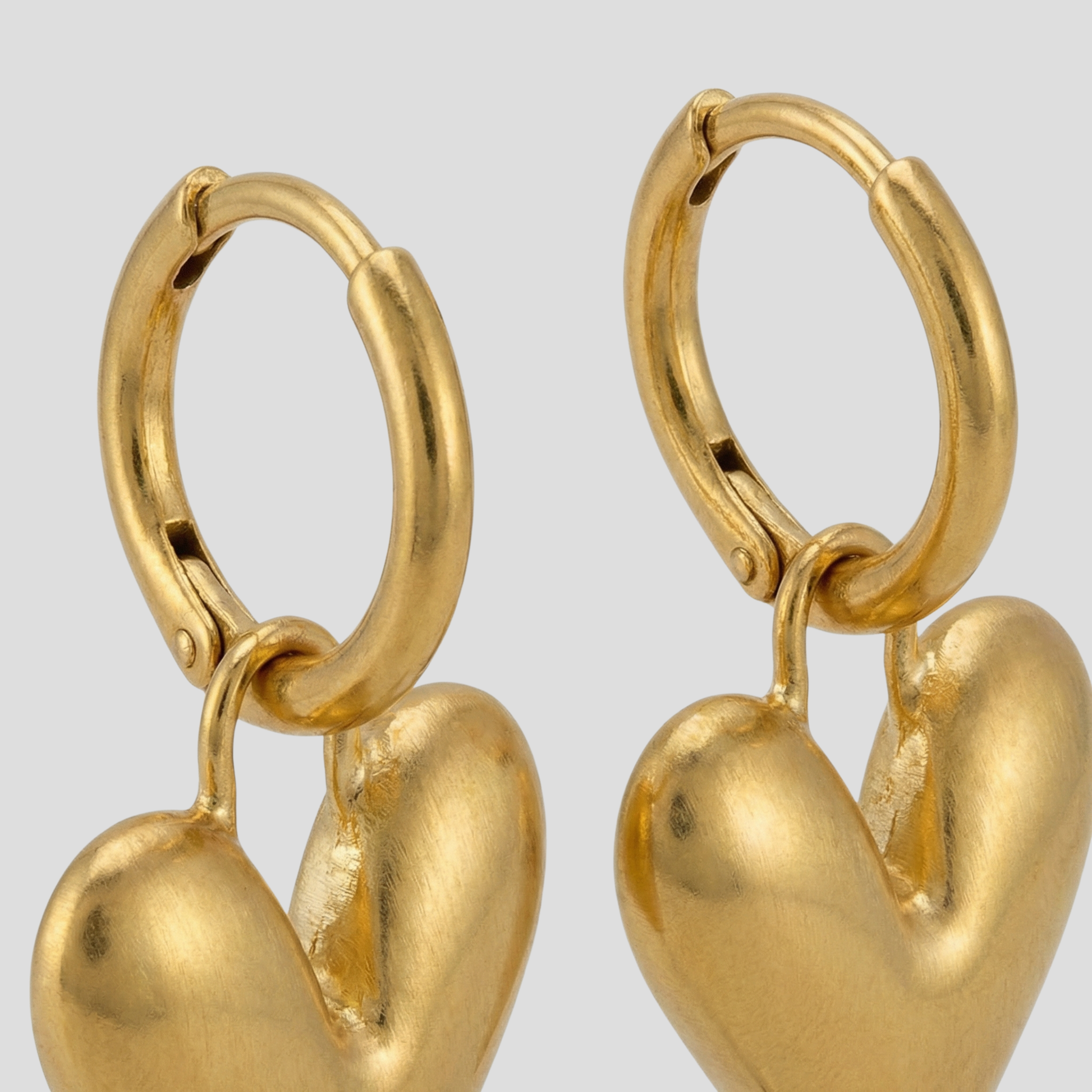 Gold-tone sculpted heart outline earrings for everyday wear