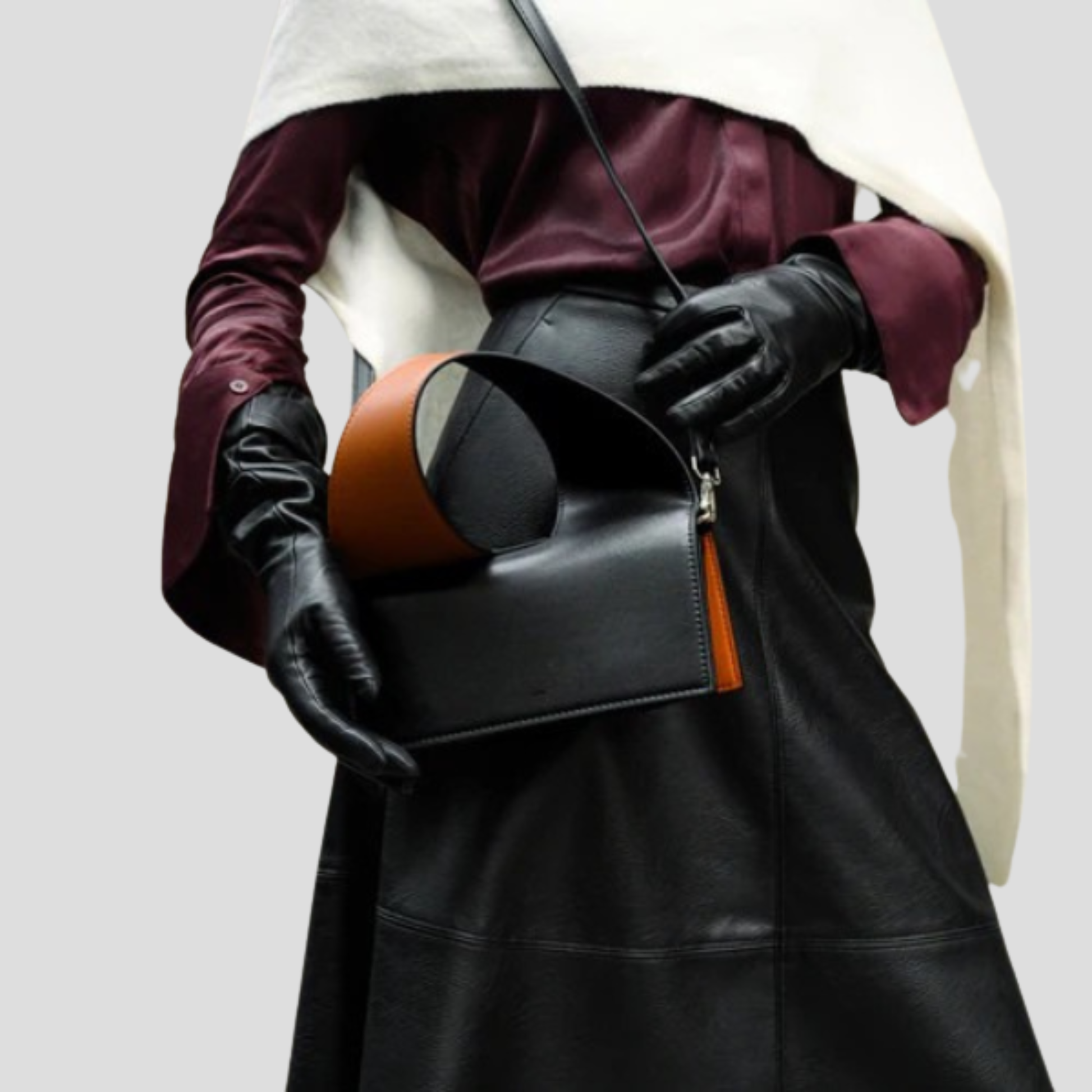 Black structured women's handbag with two-tone handle detail for daily wear