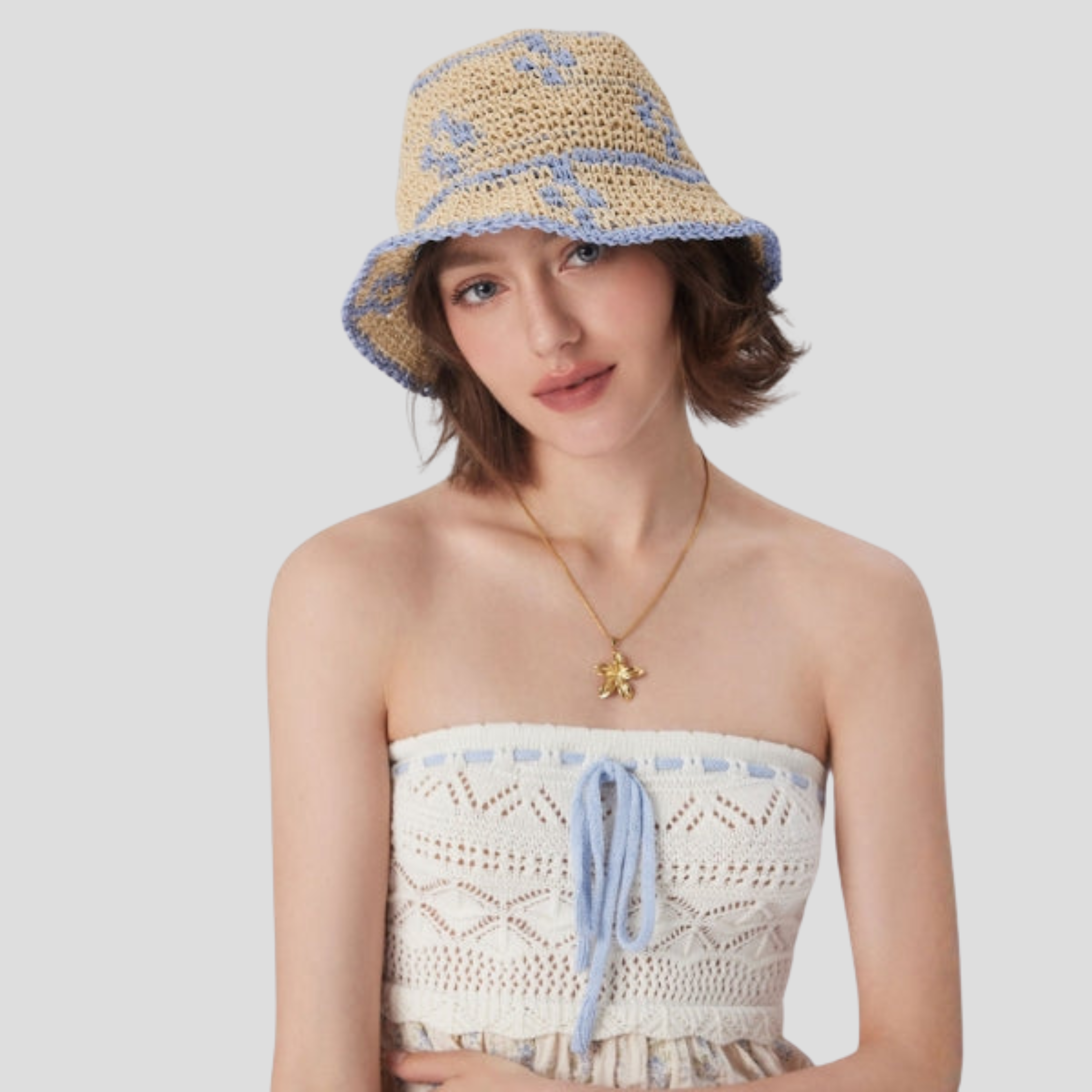 Beige two-tone woven bucket hat with a structured brim for women