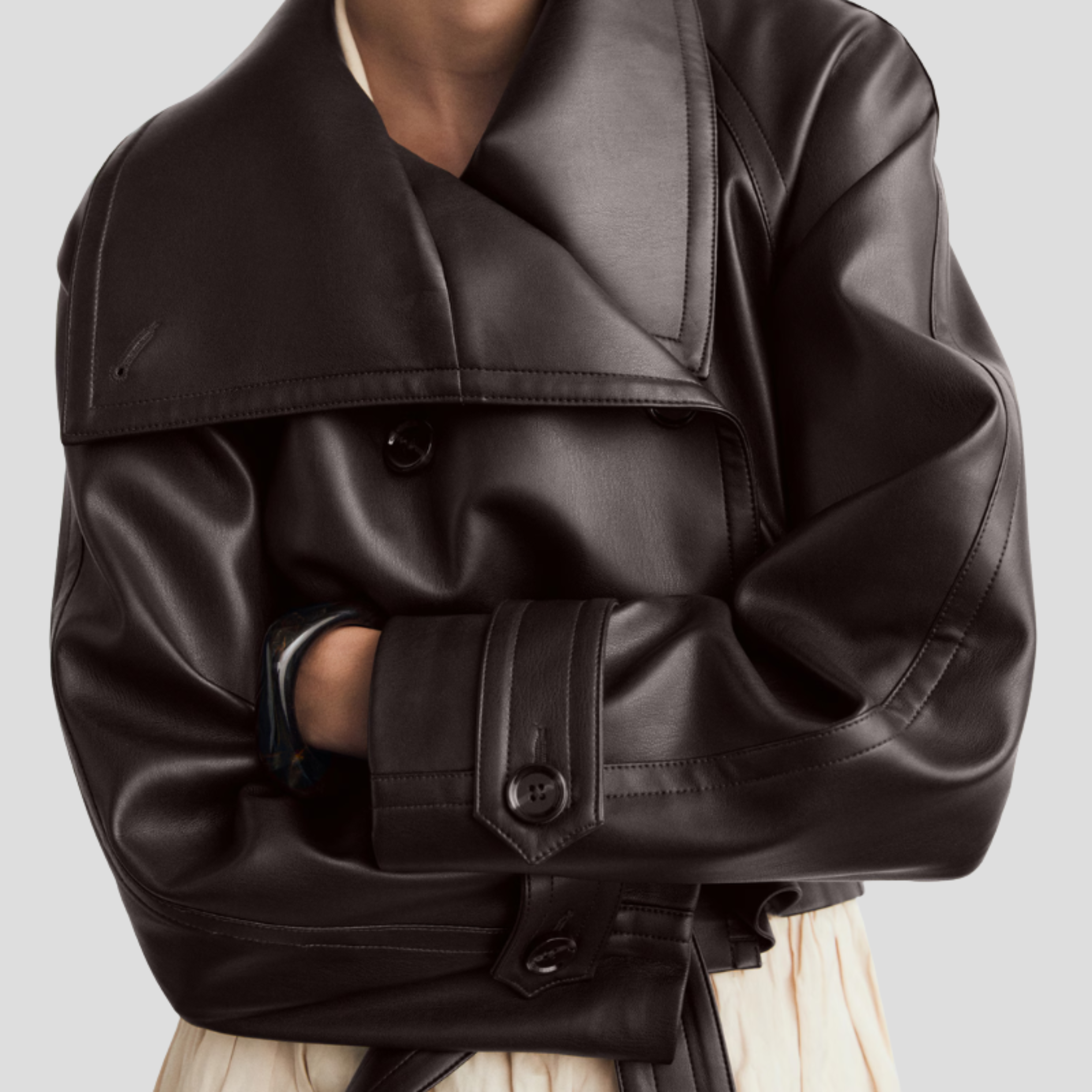 Brown cropped double-breasted women's jacket with defined collar and clean lines