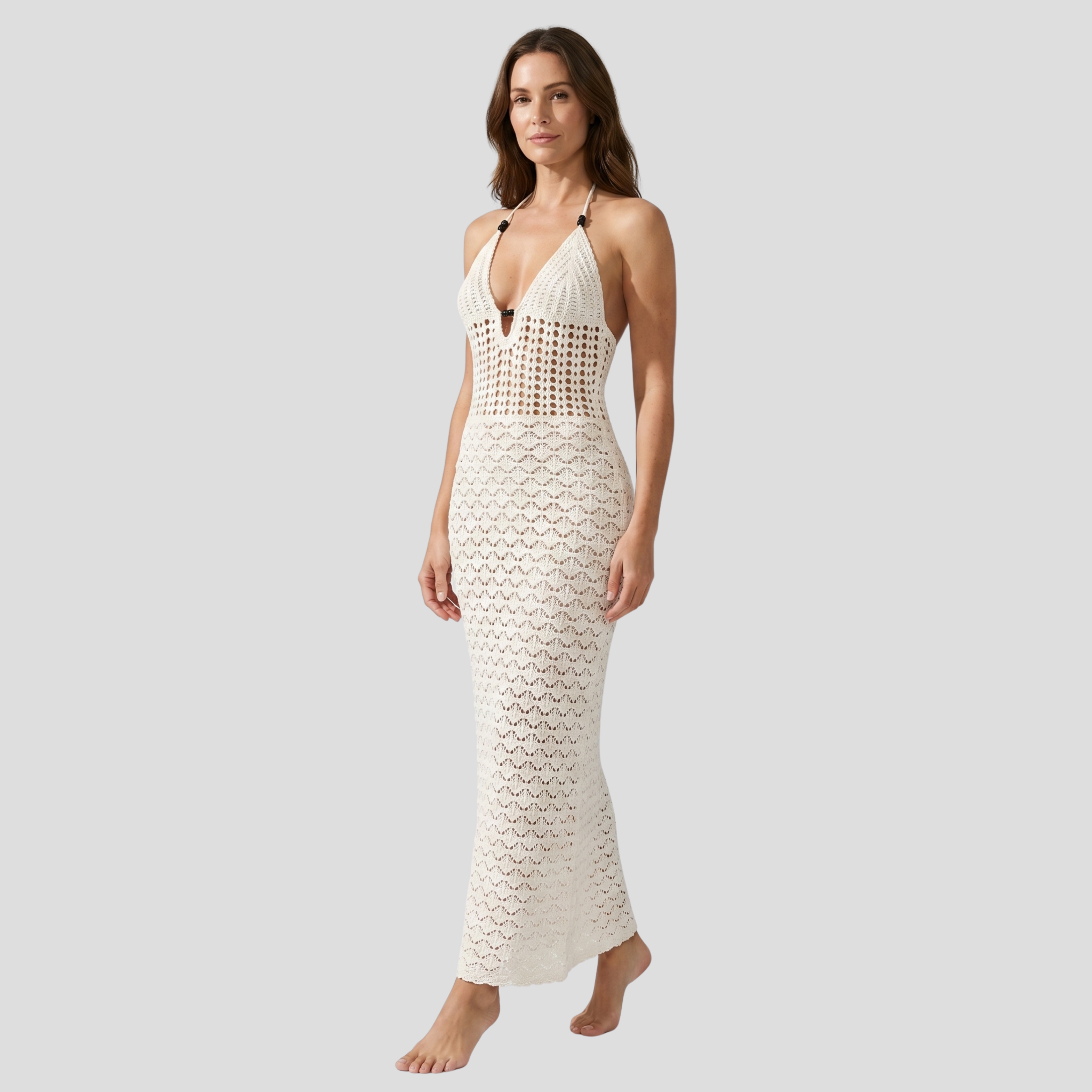 White halter neckline maxi dress with open-back detail and open-work pattern