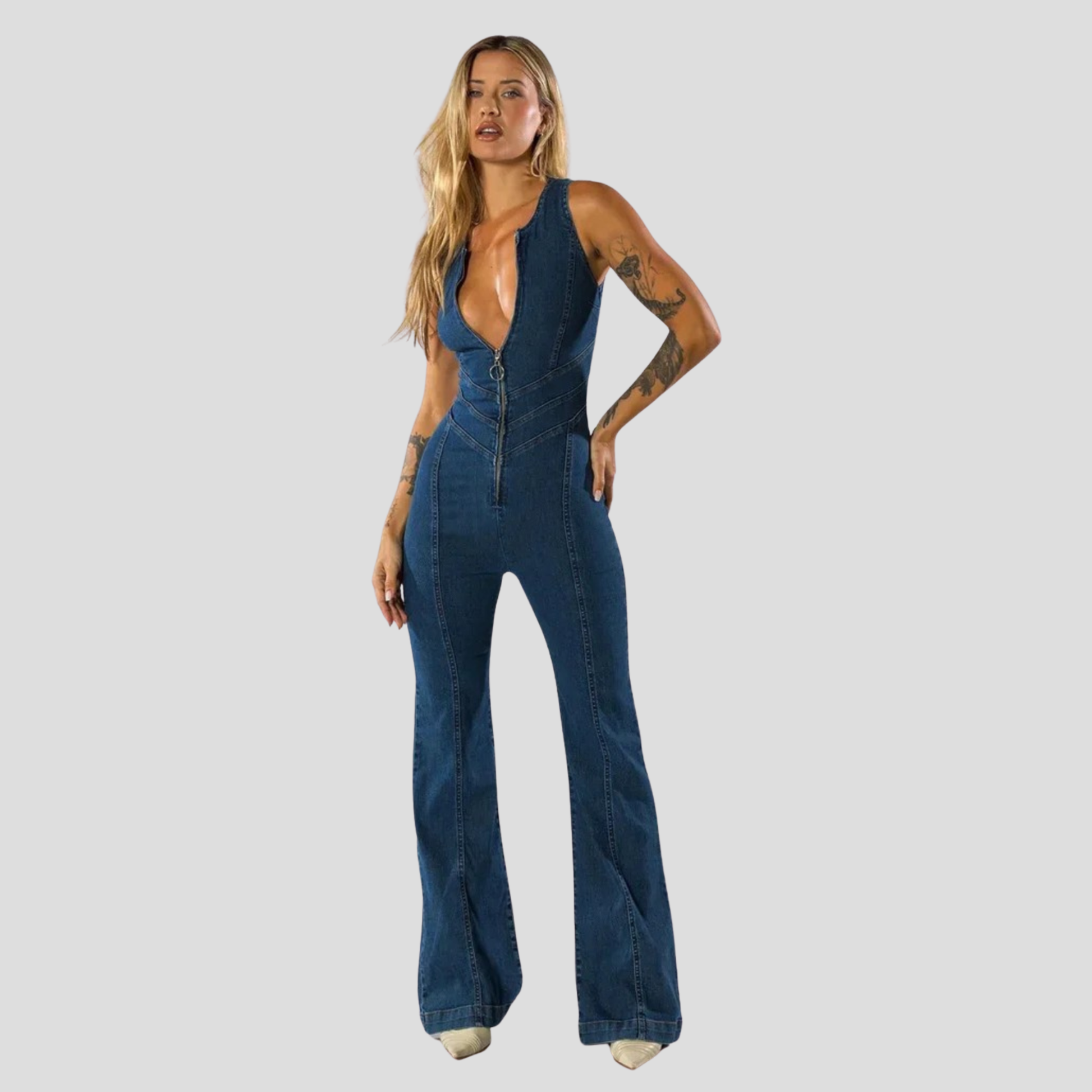 Blue women's jumpsuit with plunge neckline and open cutout back silhouette