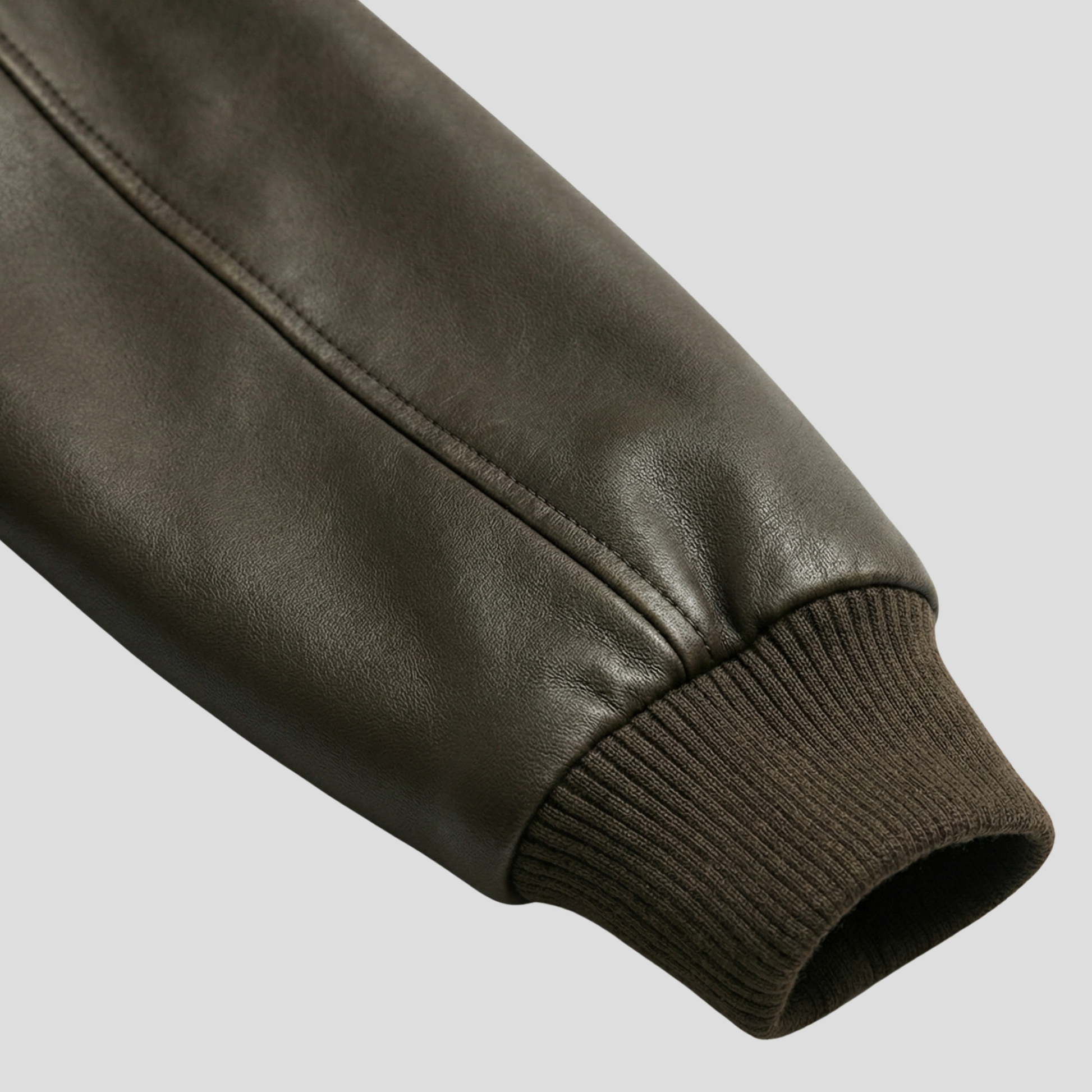 Brown women's jacket with ribbed cuffs and hem and a streamlined silhouette