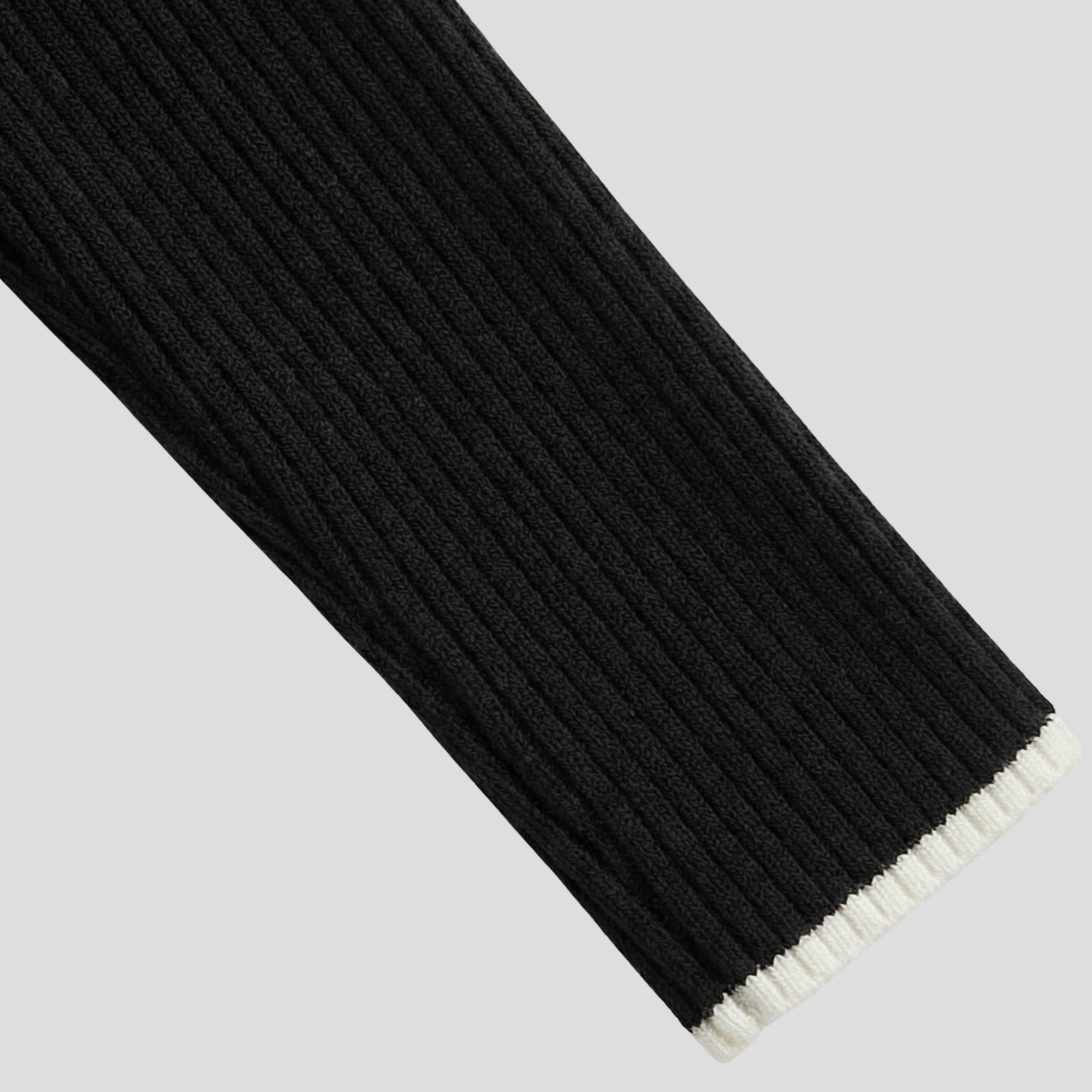 Women's black ribbed high-neck sweater with a slim silhouette
