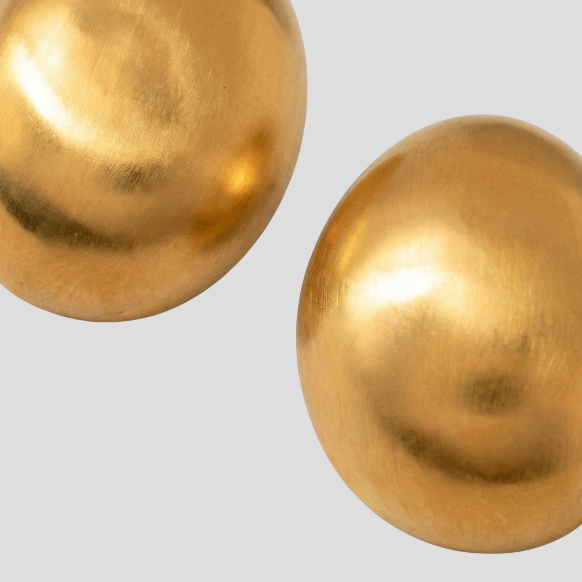Dome silhouette stud earrings with a matte gold finish for everyday wear