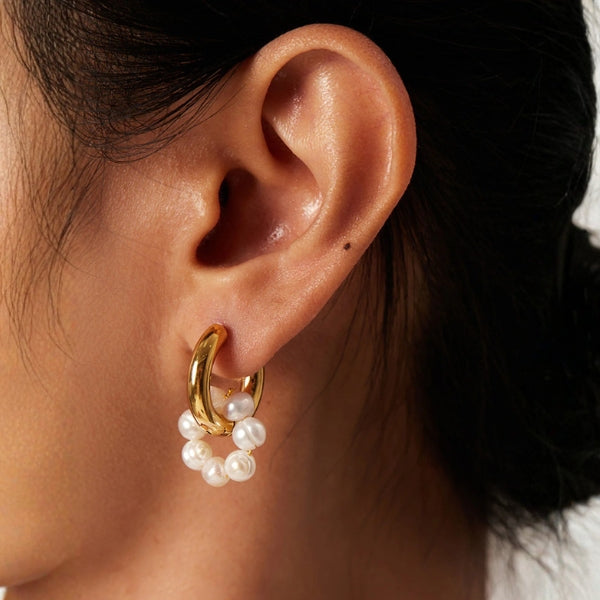 Gold-tone mismatched hoop earrings with delicate bead drop detail for women