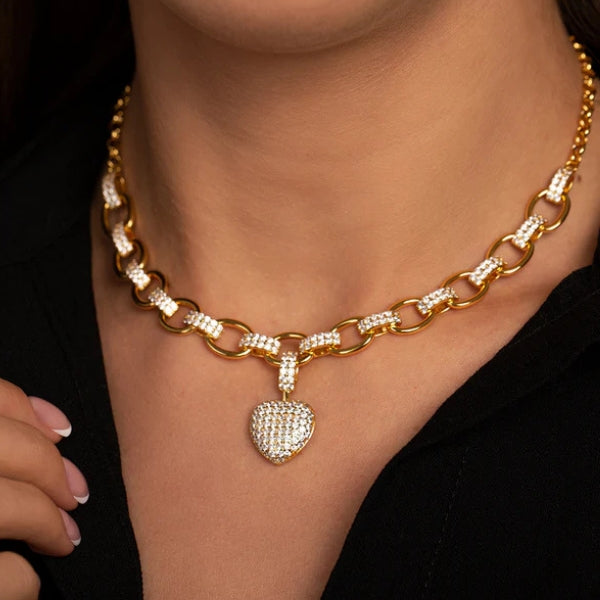 Women's jewelry set with oval chain and pavé heart pendant in gold and silver