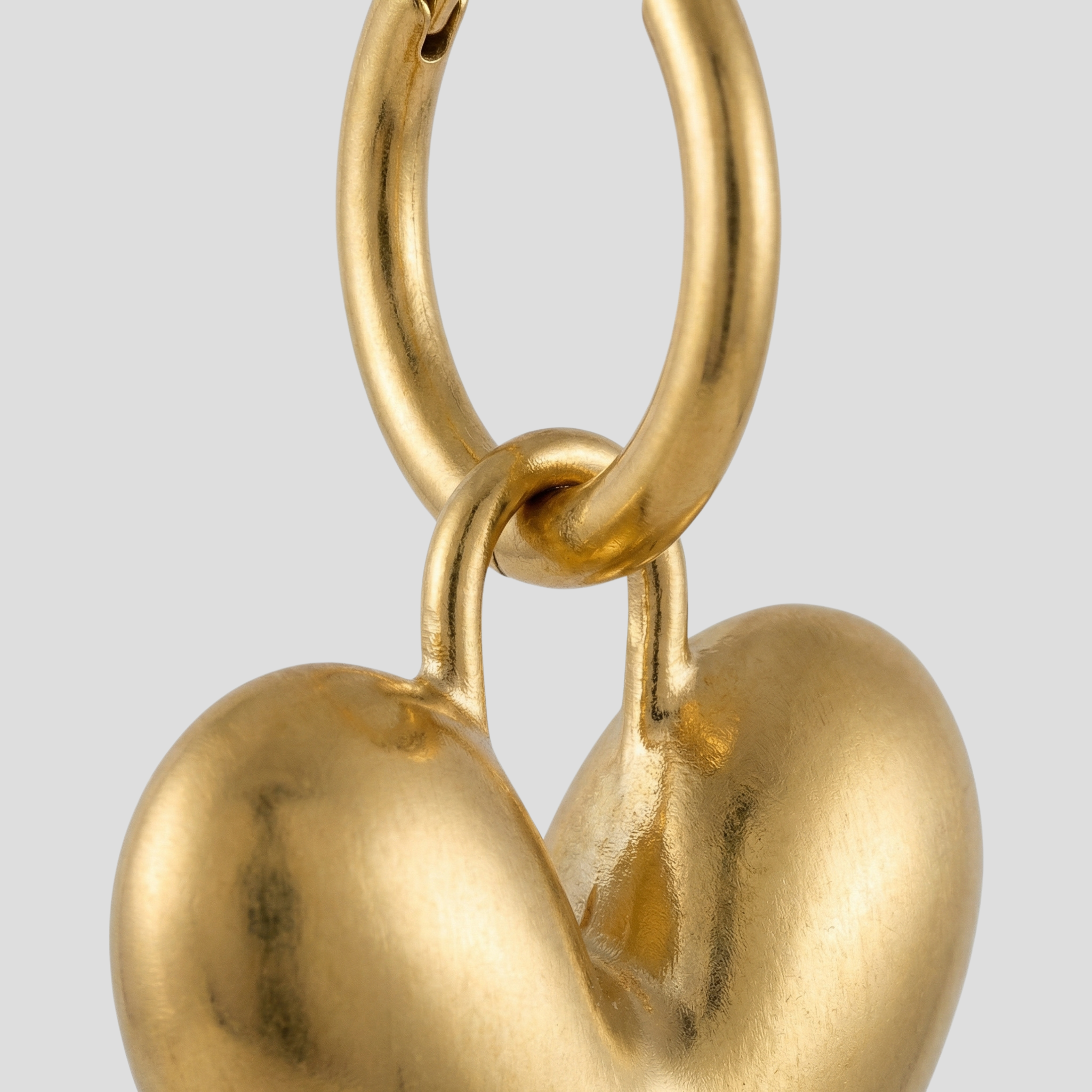 Gold-tone sculpted heart outline earrings for everyday wear