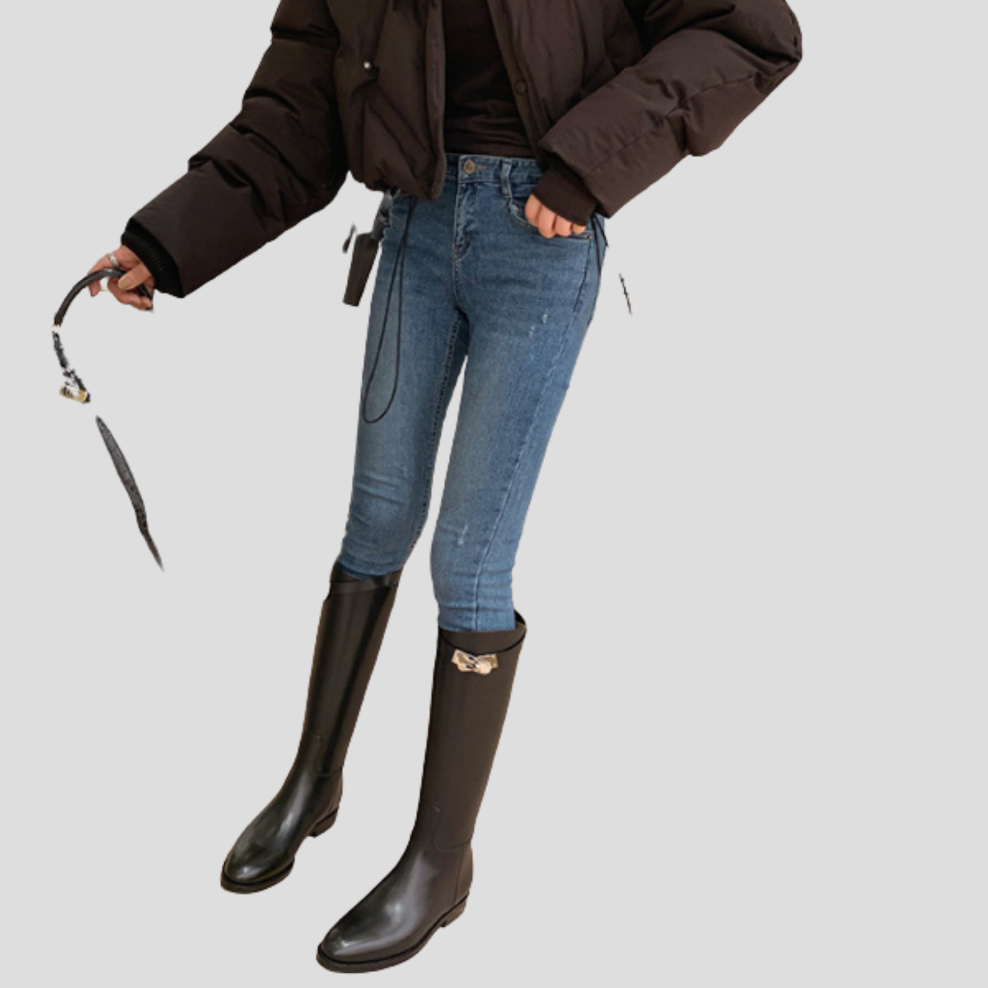 Black knee-high boots with buckle detail on the shaft and a rounded toe
