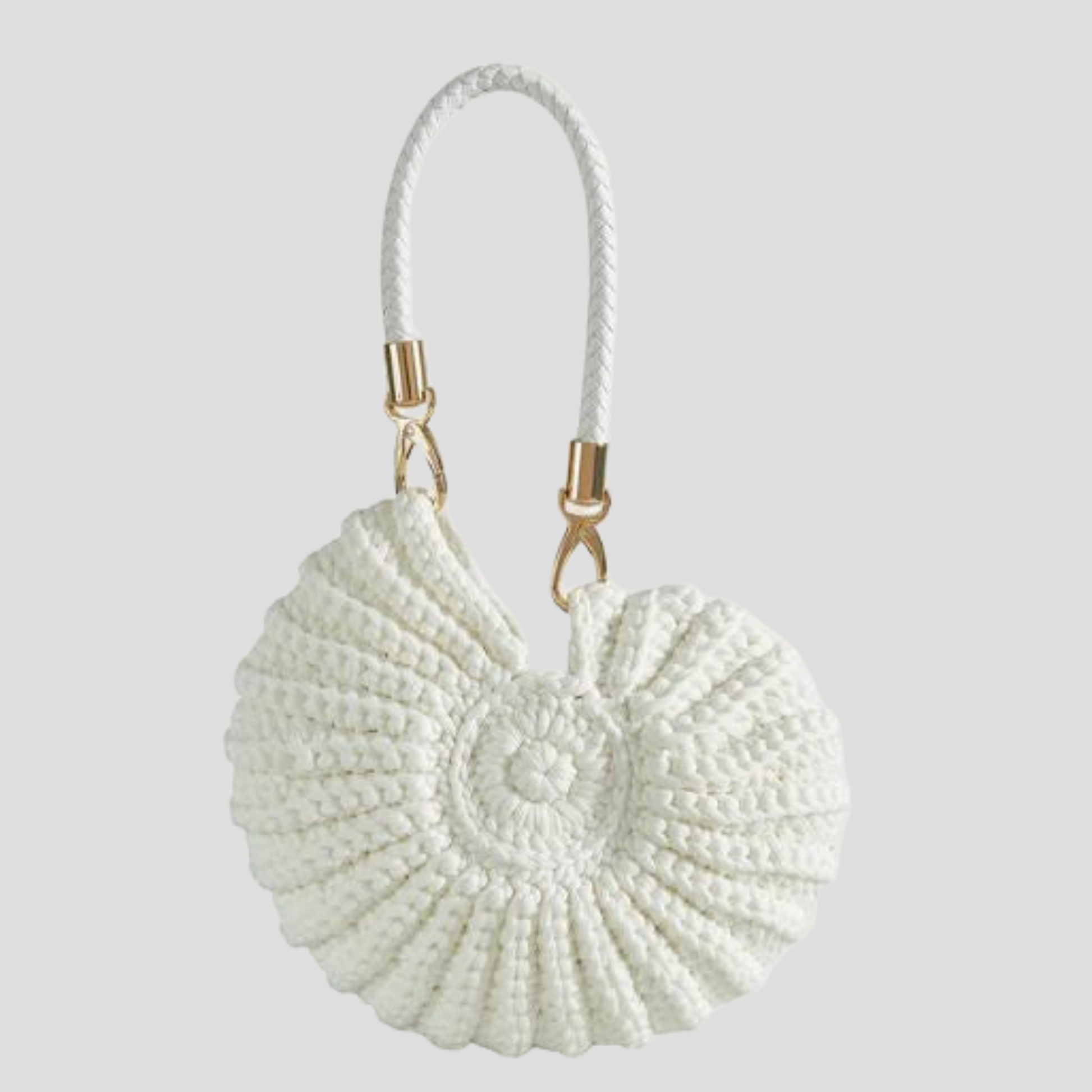 Conch-shaped woven handbag with sculptural silhouette, shown in blue, black, and white