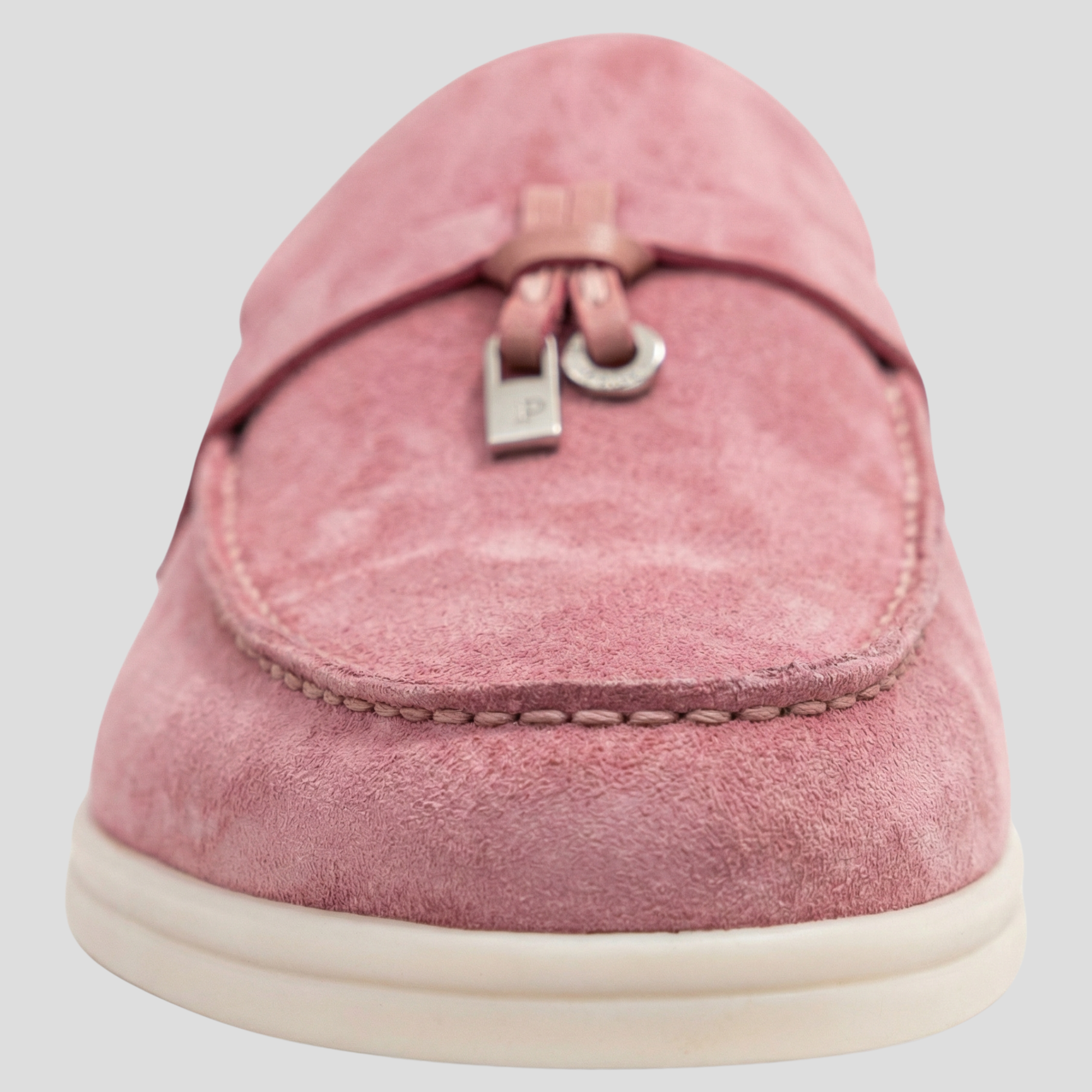 Women's backless loafer mules with tassel detail shown in multiple colors