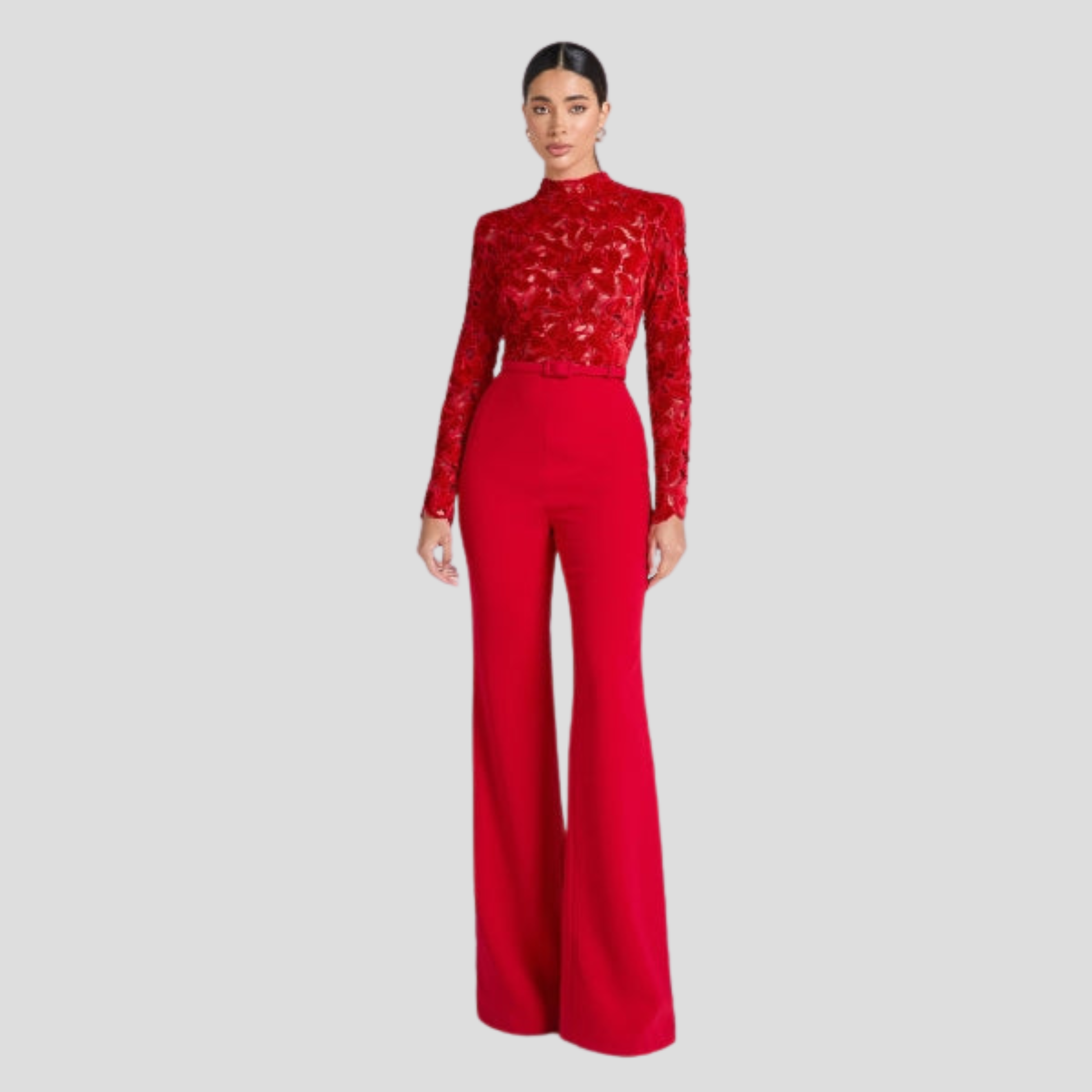 Red women's high-neck jumpsuit with belted waist and flared silhouette