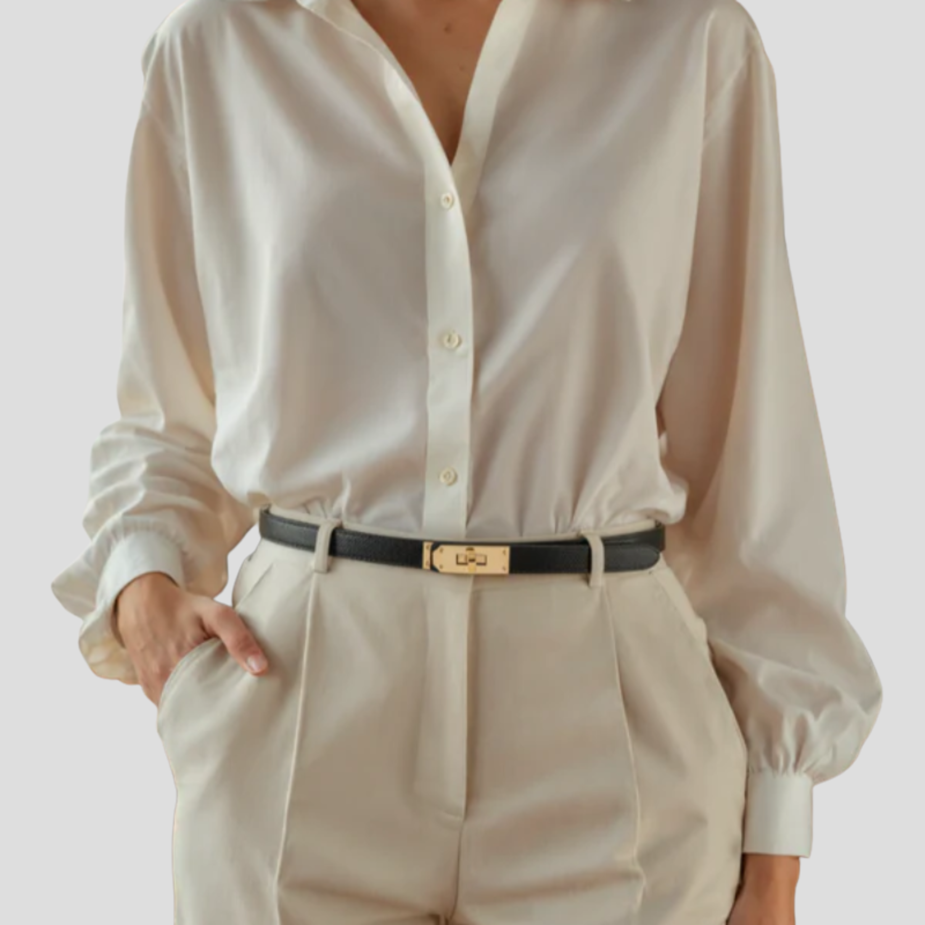 Women's straight-strap belt with a defined buckle, shown in neutral colors
