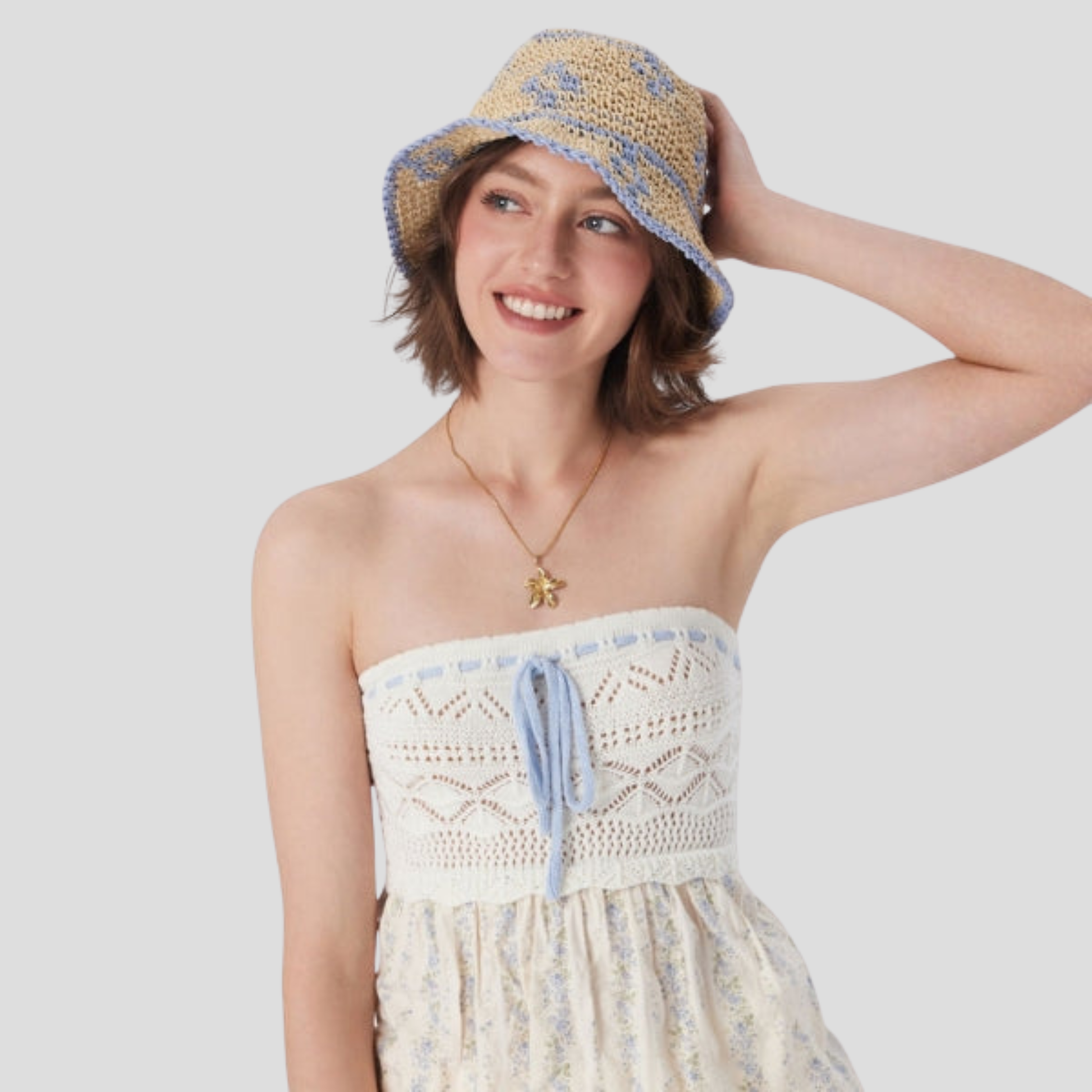 Beige two-tone woven bucket hat with a structured brim for women